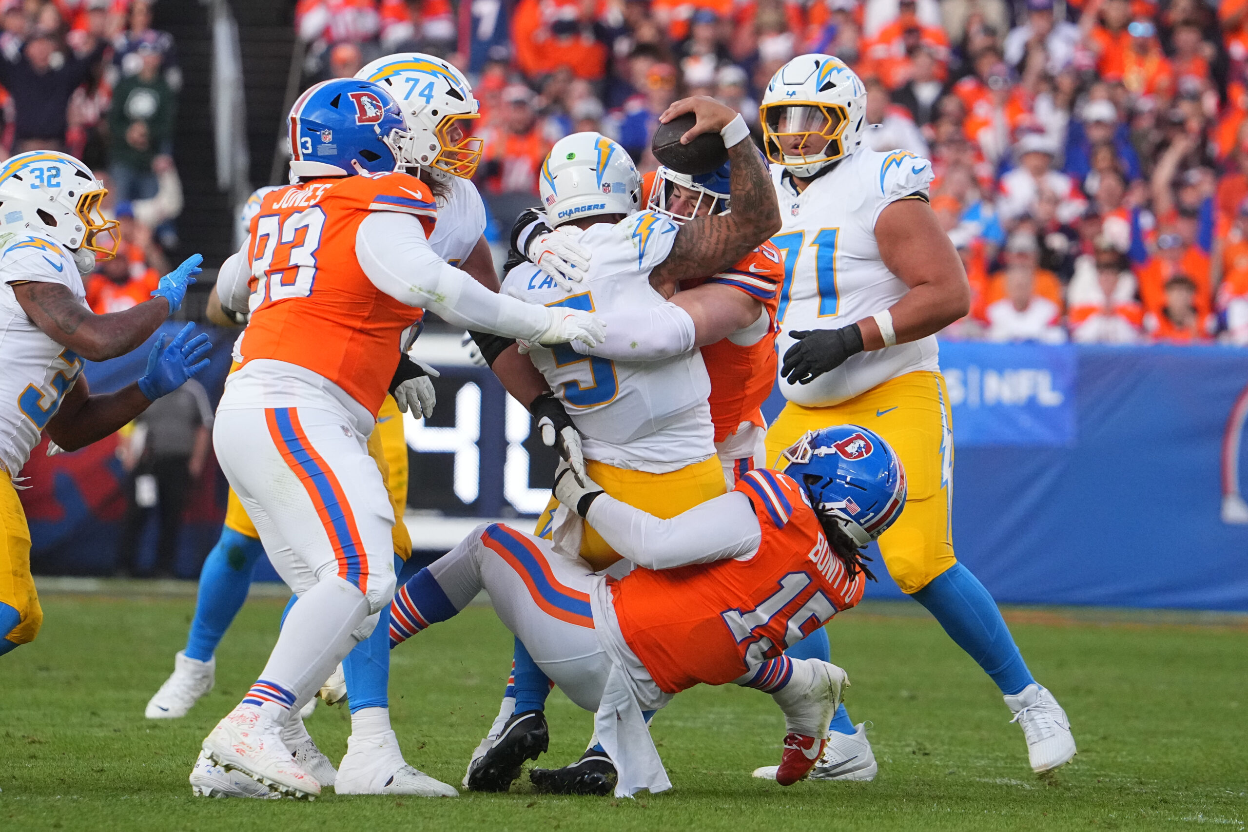Denver Broncos defensive end Zach Allen (99) and Denver Broncos...