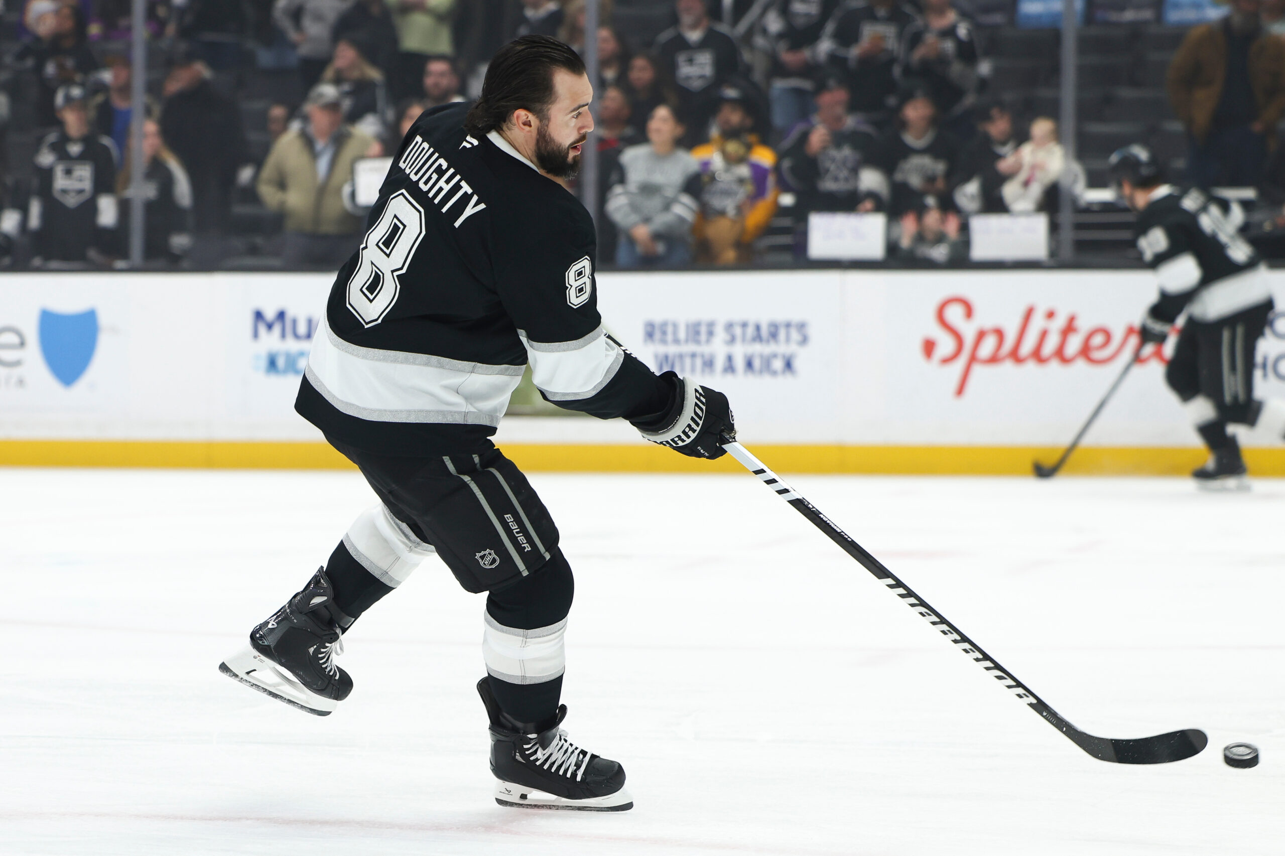 Kings defenseman Drew Doughty (8) warms up before a game...