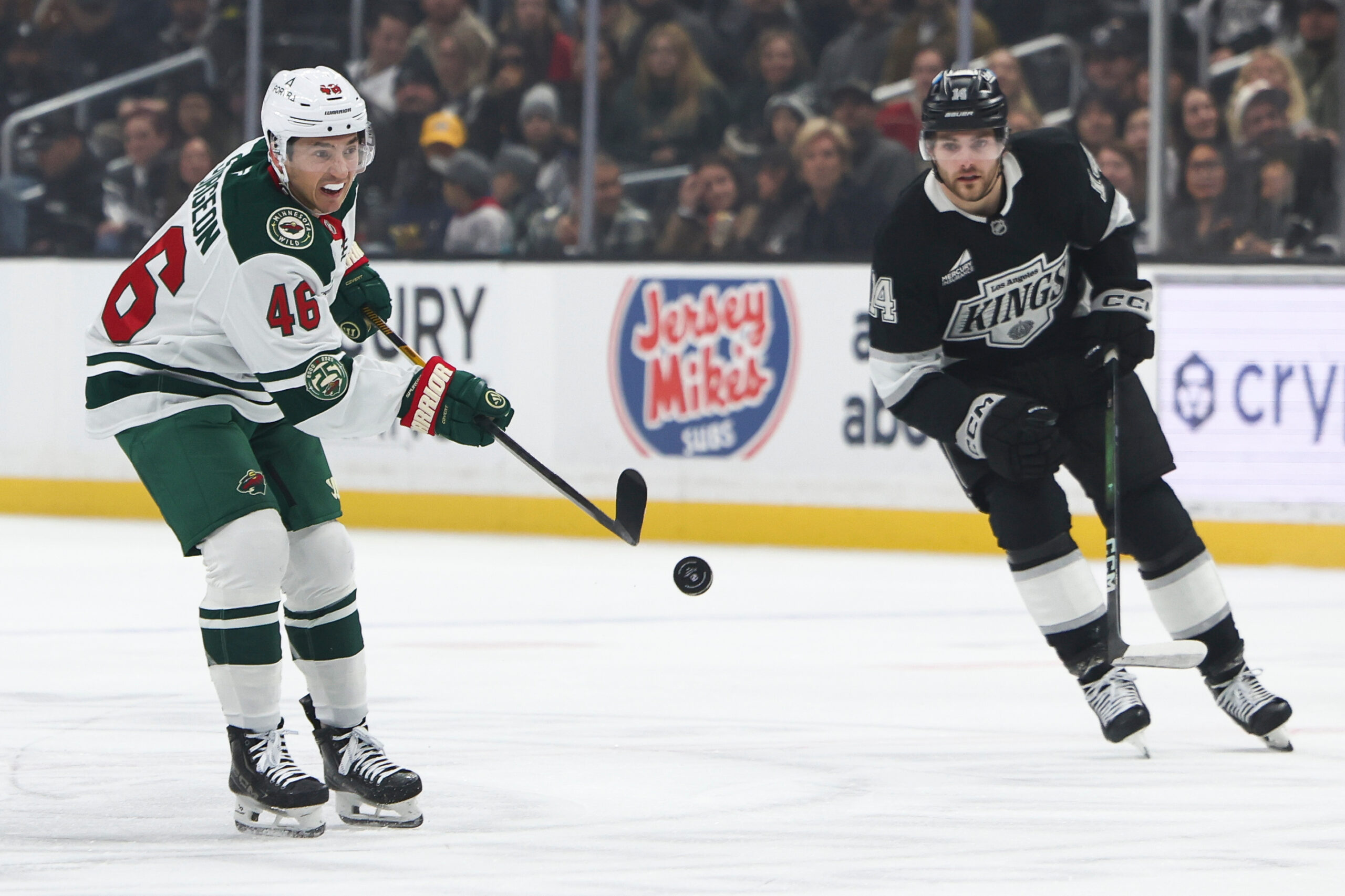 Minnesota Wild defenseman Jared Spurgeon (46) shoots as Kings right...