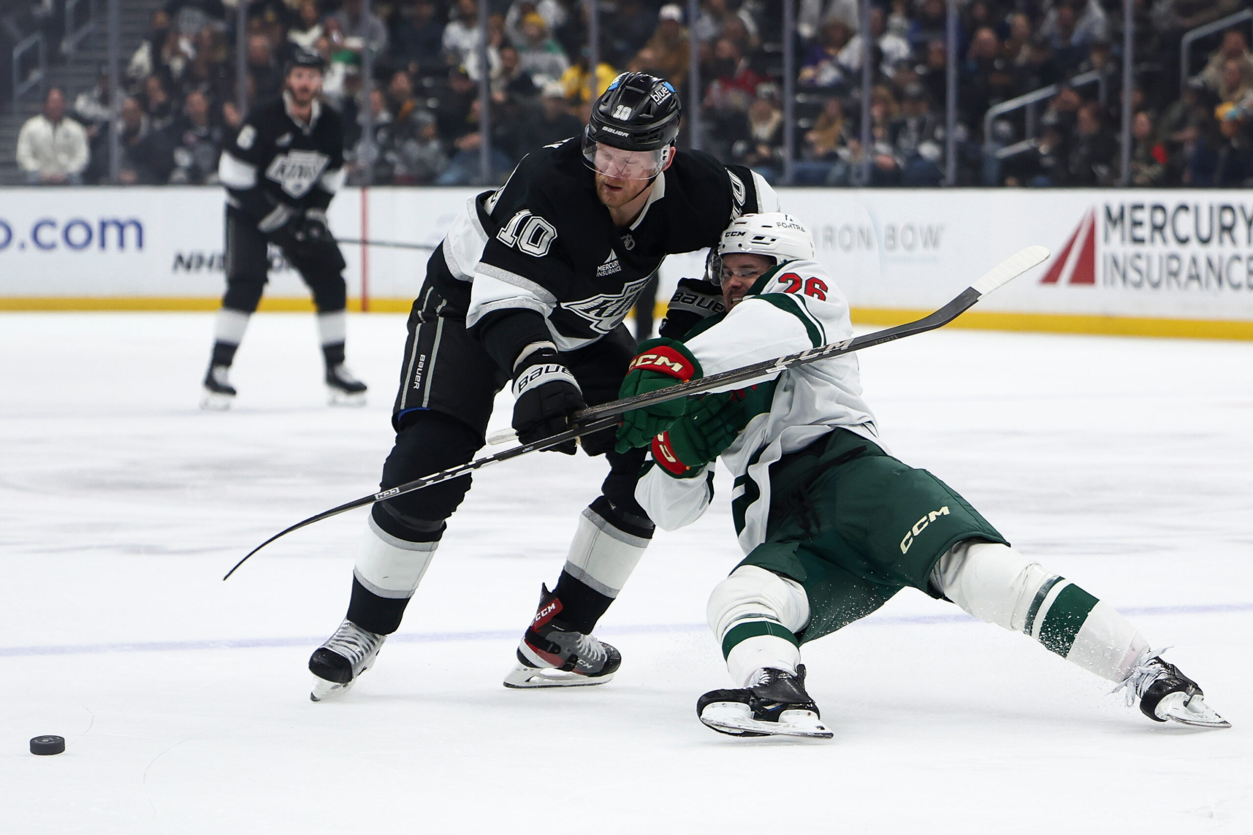 Kings right wing Corey Perry (10) and Minnesota Wild defenseman...