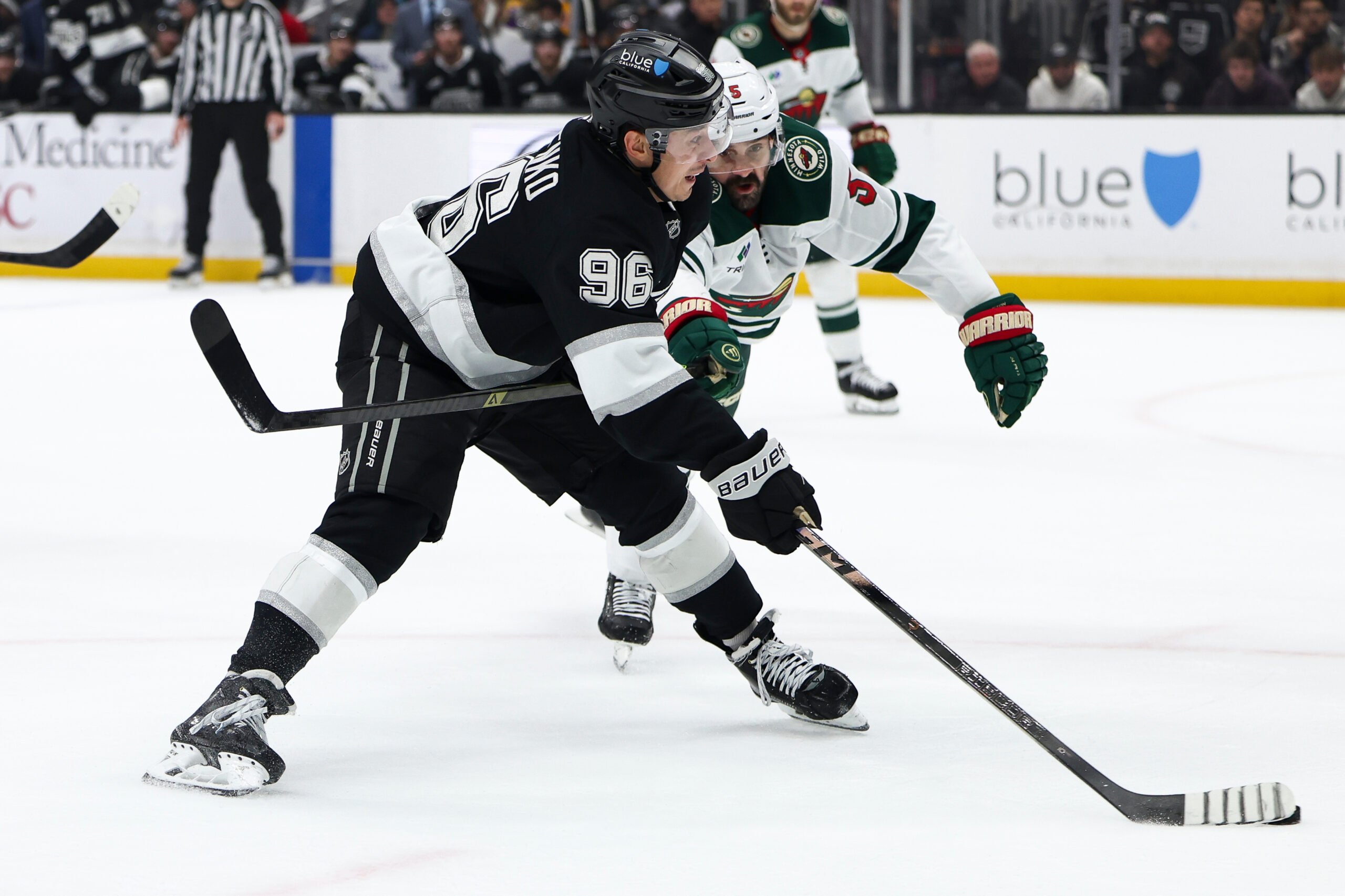Kings left wing Andrei Kuzmenko (96) passes the puck as...