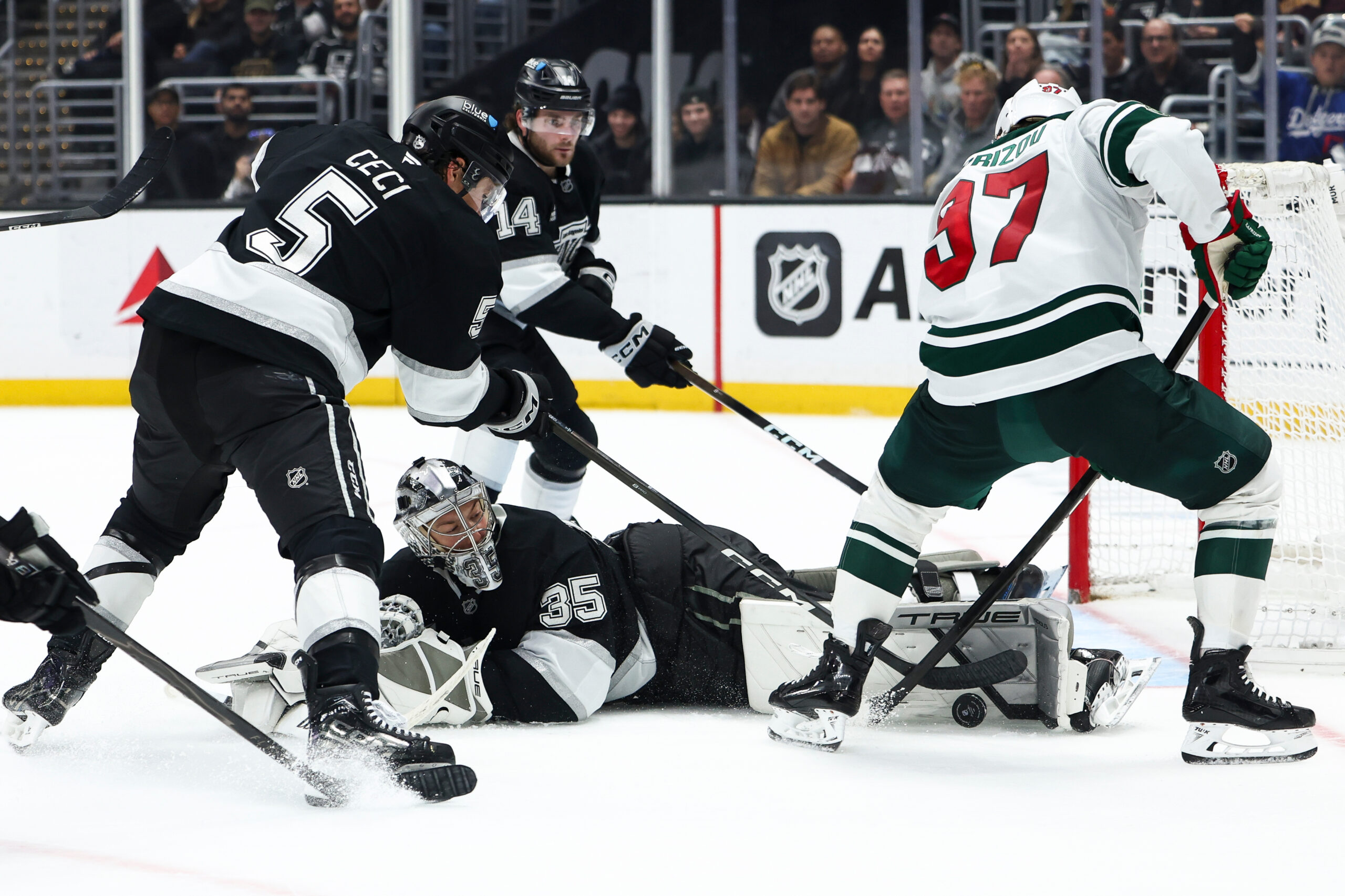 Kings goaltender Darcy Kuemper (35) makes a save against Minnesota...