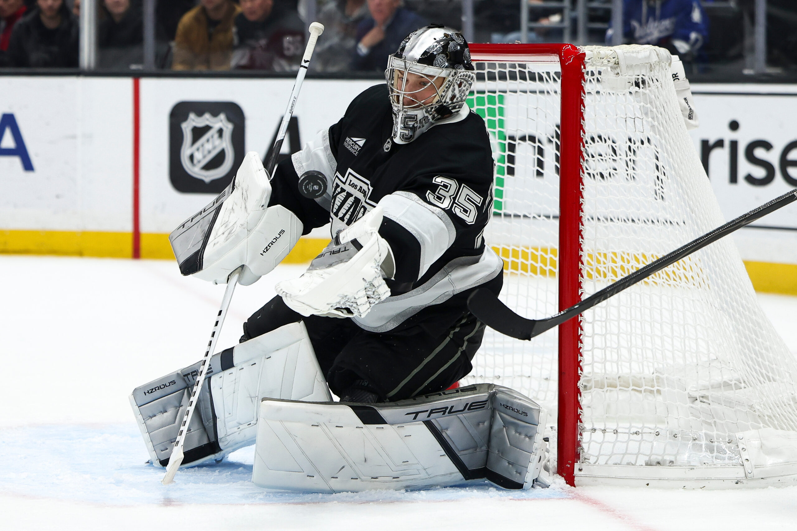 Kings goaltender Darcy Kuemper (35) makes a save during the...