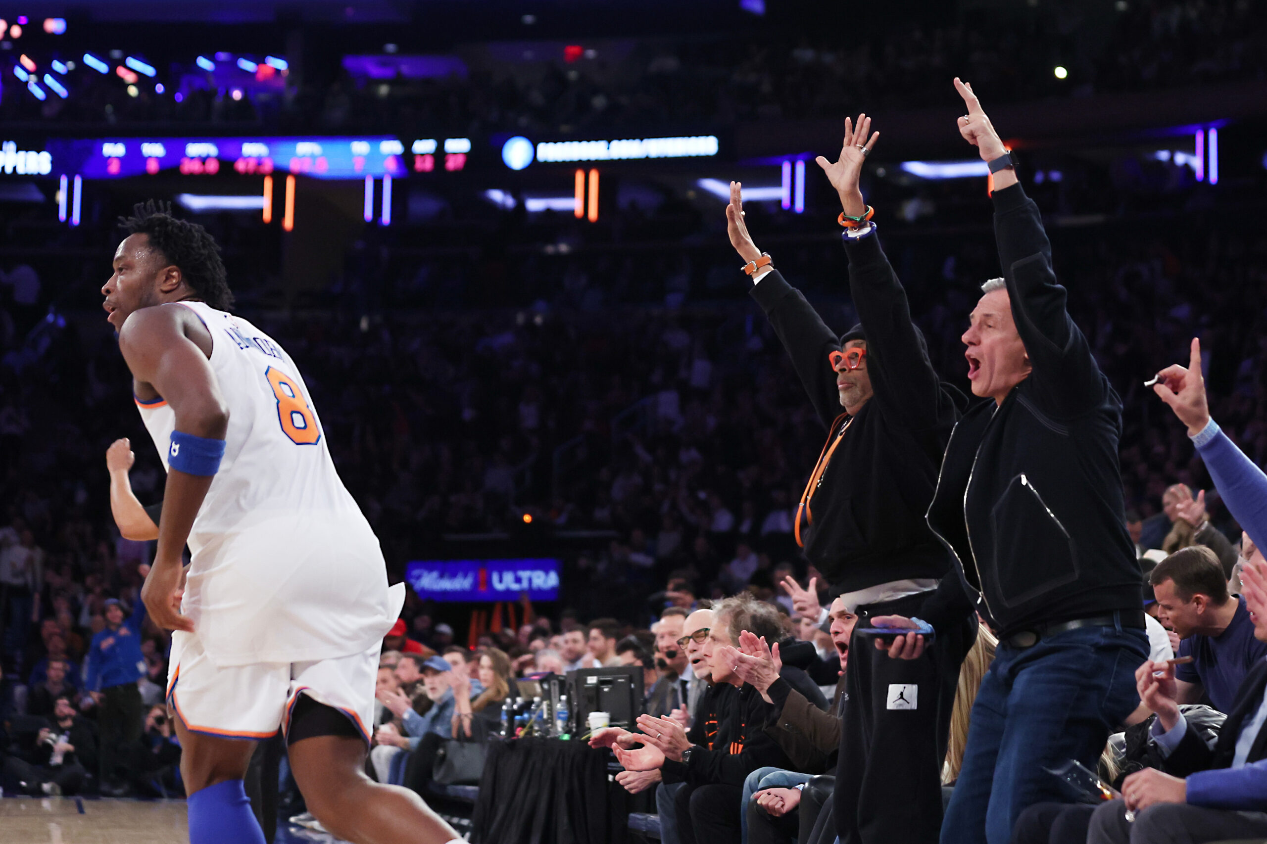 Members of celebrity row including Spike Lee, center left, celebrate...