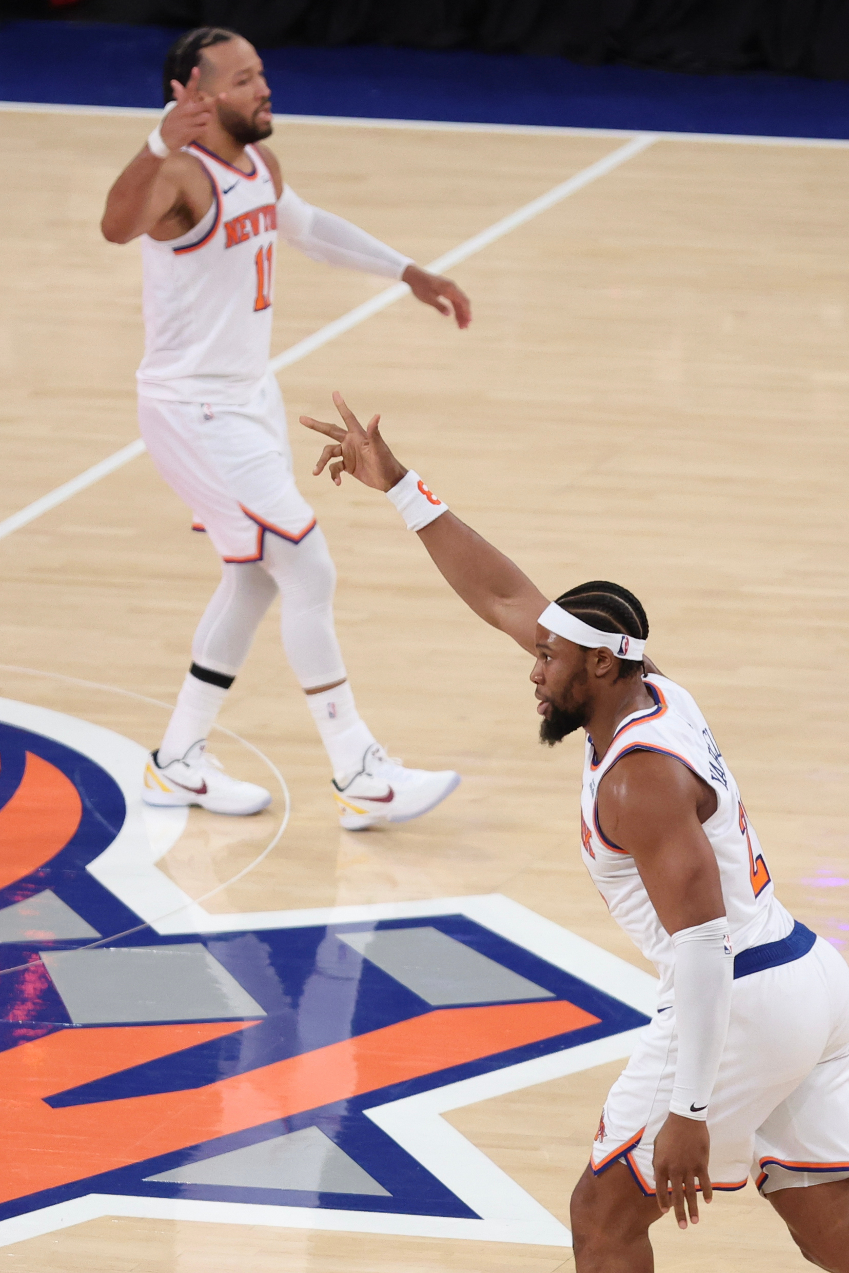 New York Knicks forward Guerschon Yabusele, right, gestures after making...