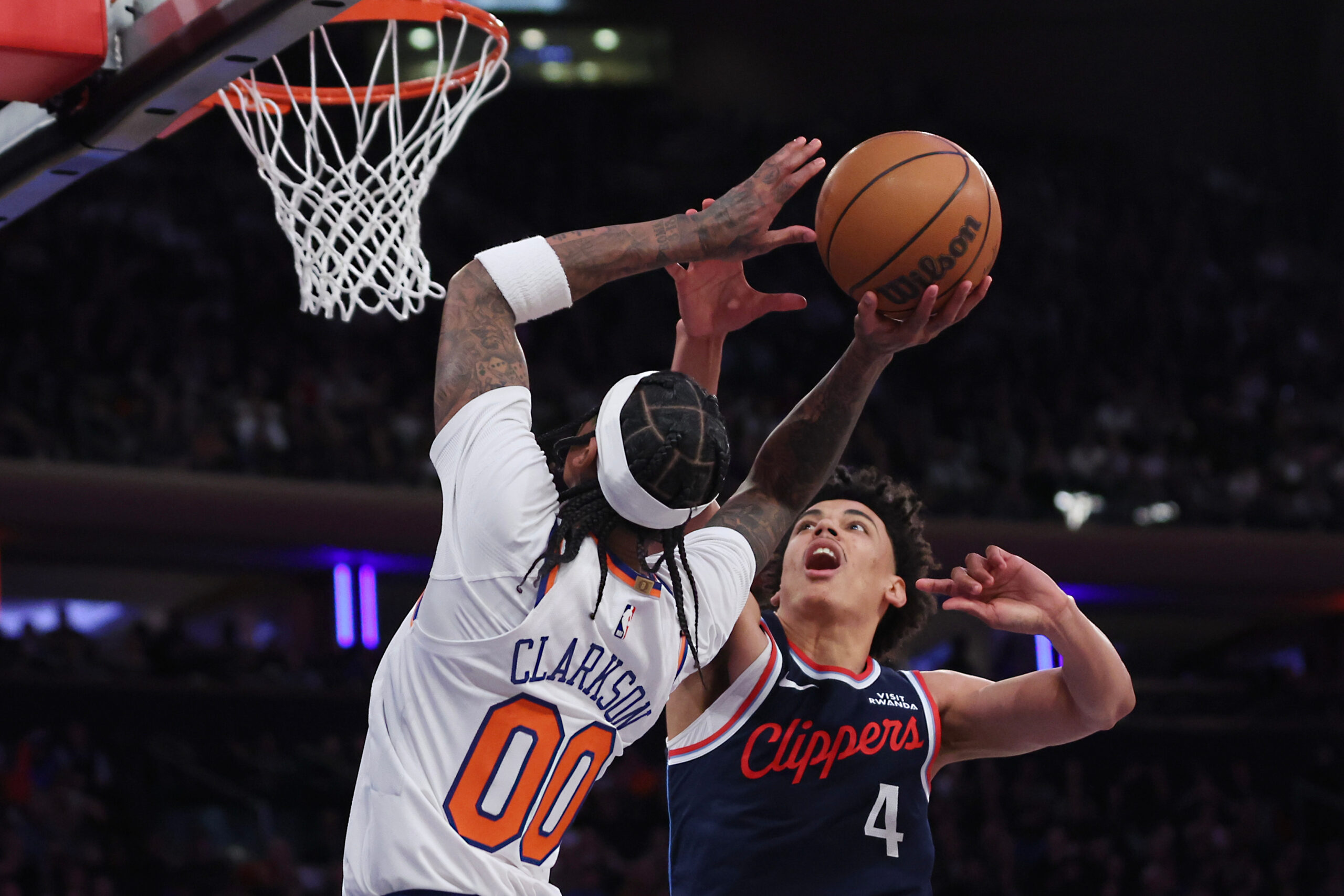 New York Knicks guard Jordan Clarkson, left, drives to the...