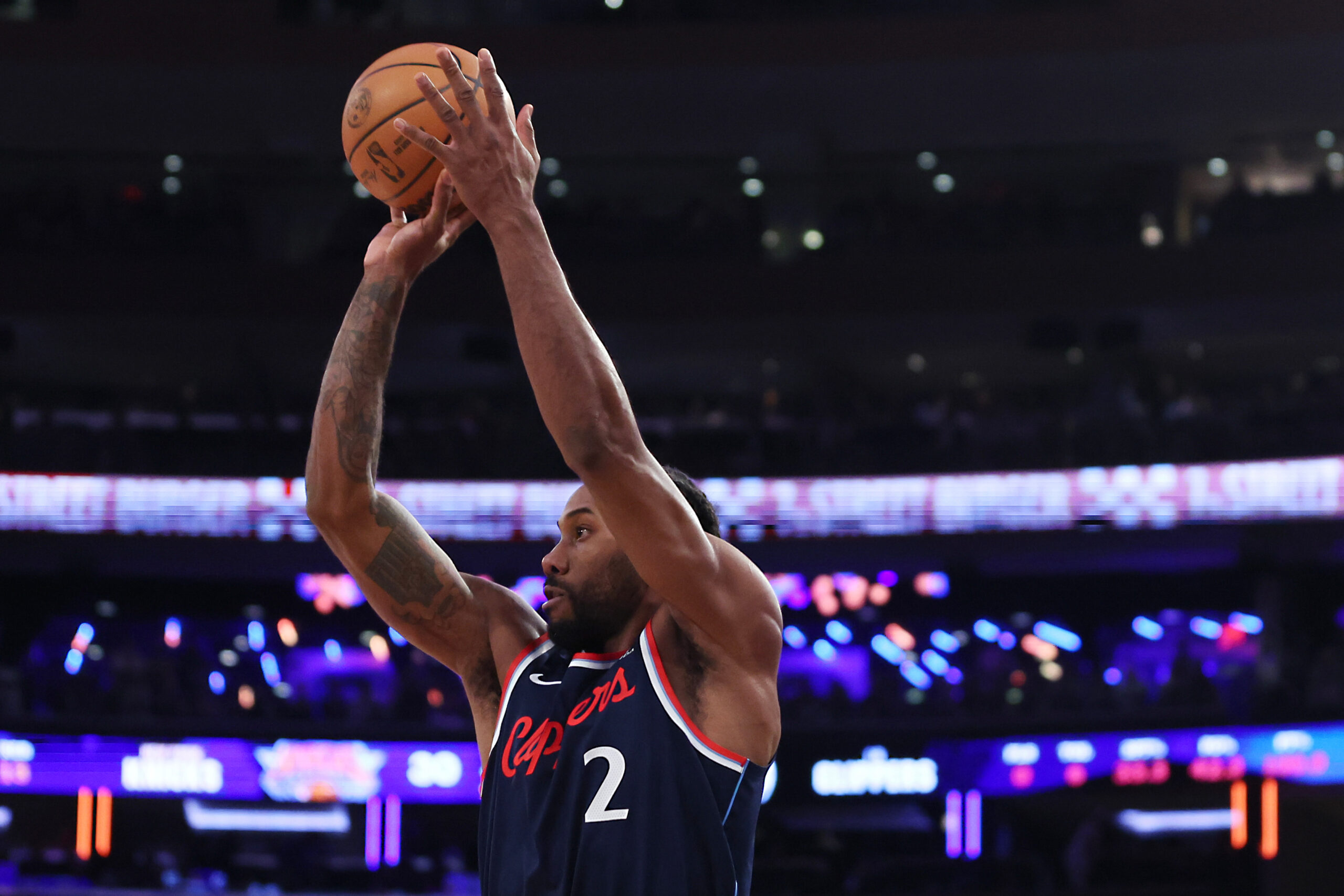 Clippers star Kawhi Leonard takes a shot during the first...