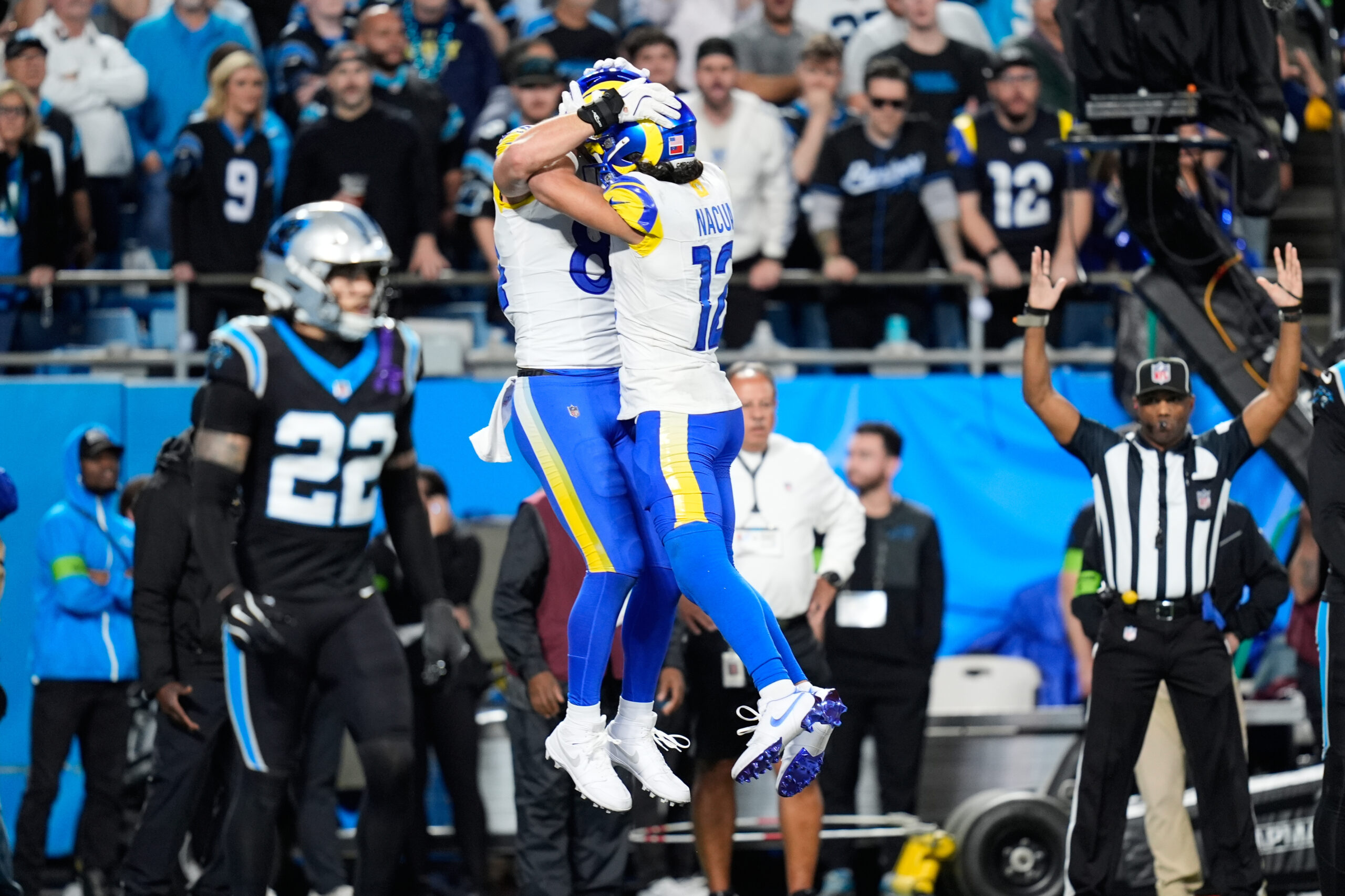 Rams tight end Colby Parkinson, center left, celebrates his touchdown...