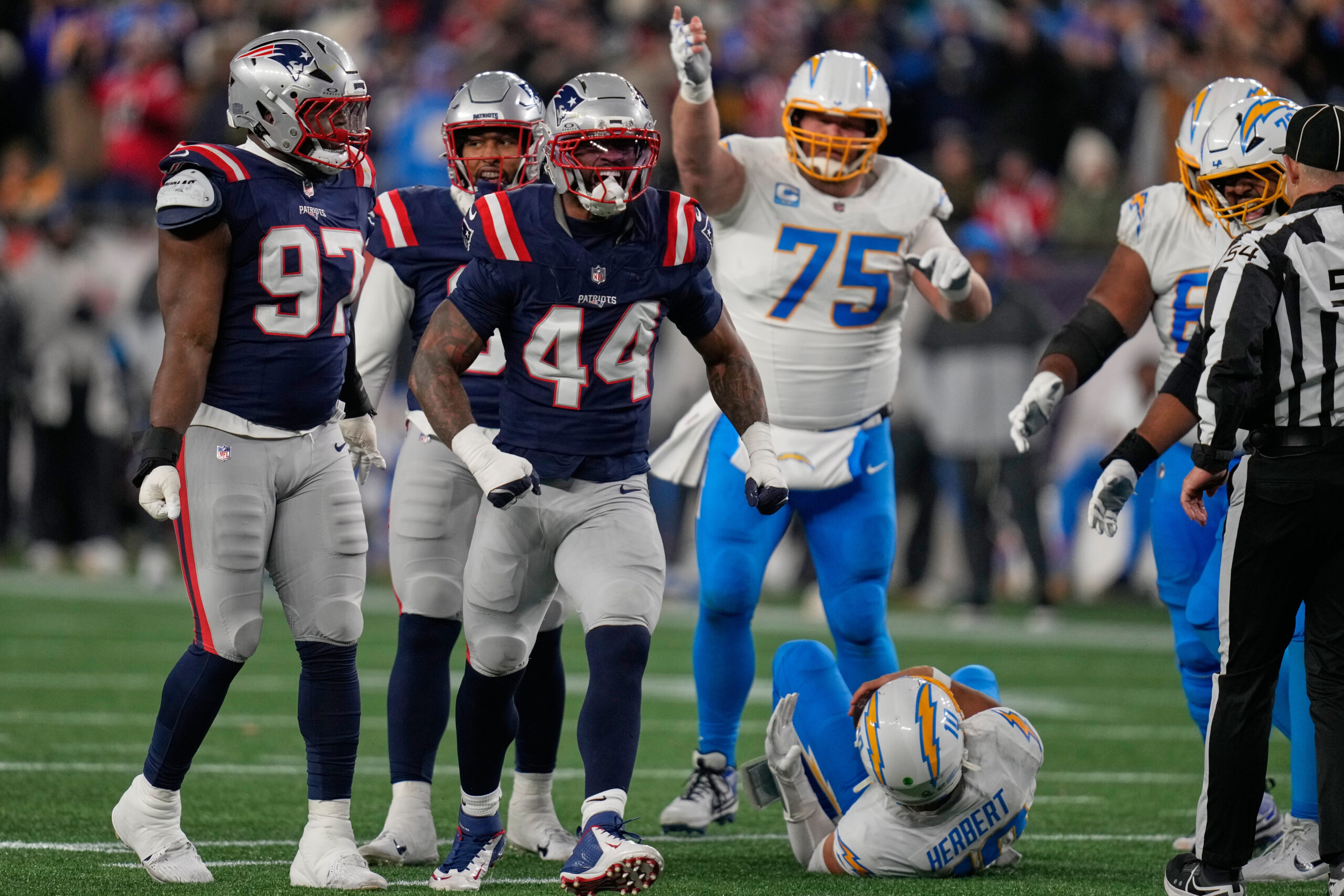 New England Patriots linebacker K’lavon Chaisson (44) celebrates a sack...