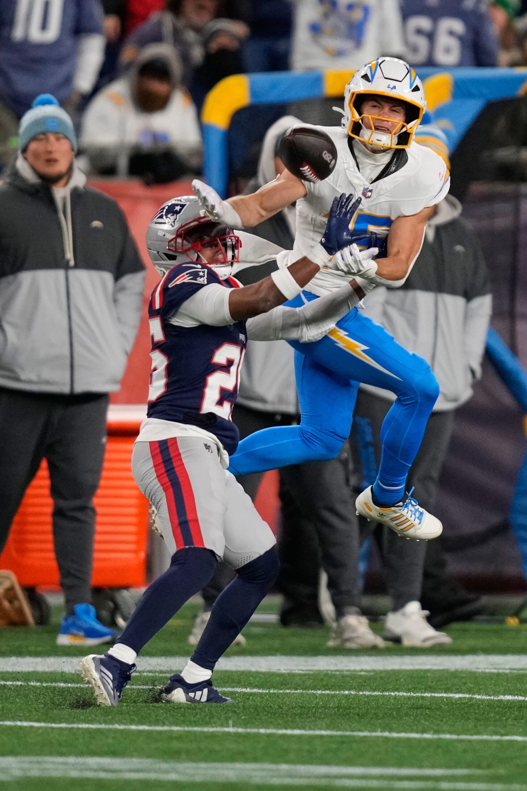 New England Patriots cornerback Marcus Jones, left, breaks up a...