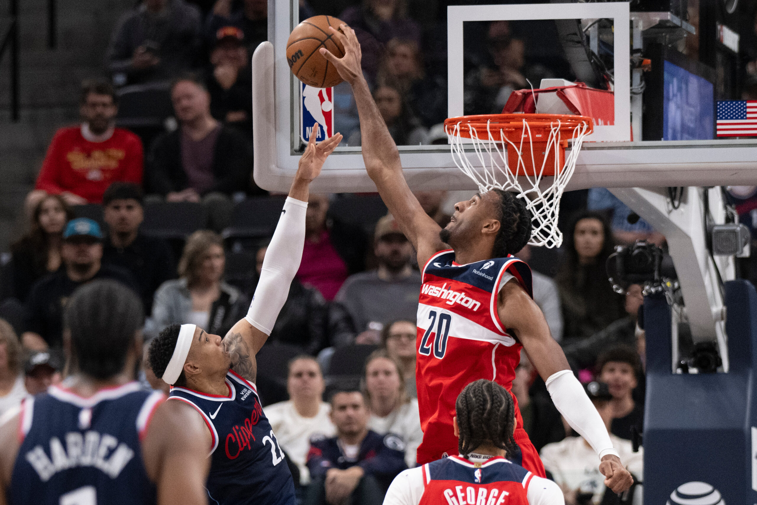 Washington Wizards center Alex Sarr, right, blocks a shot by...