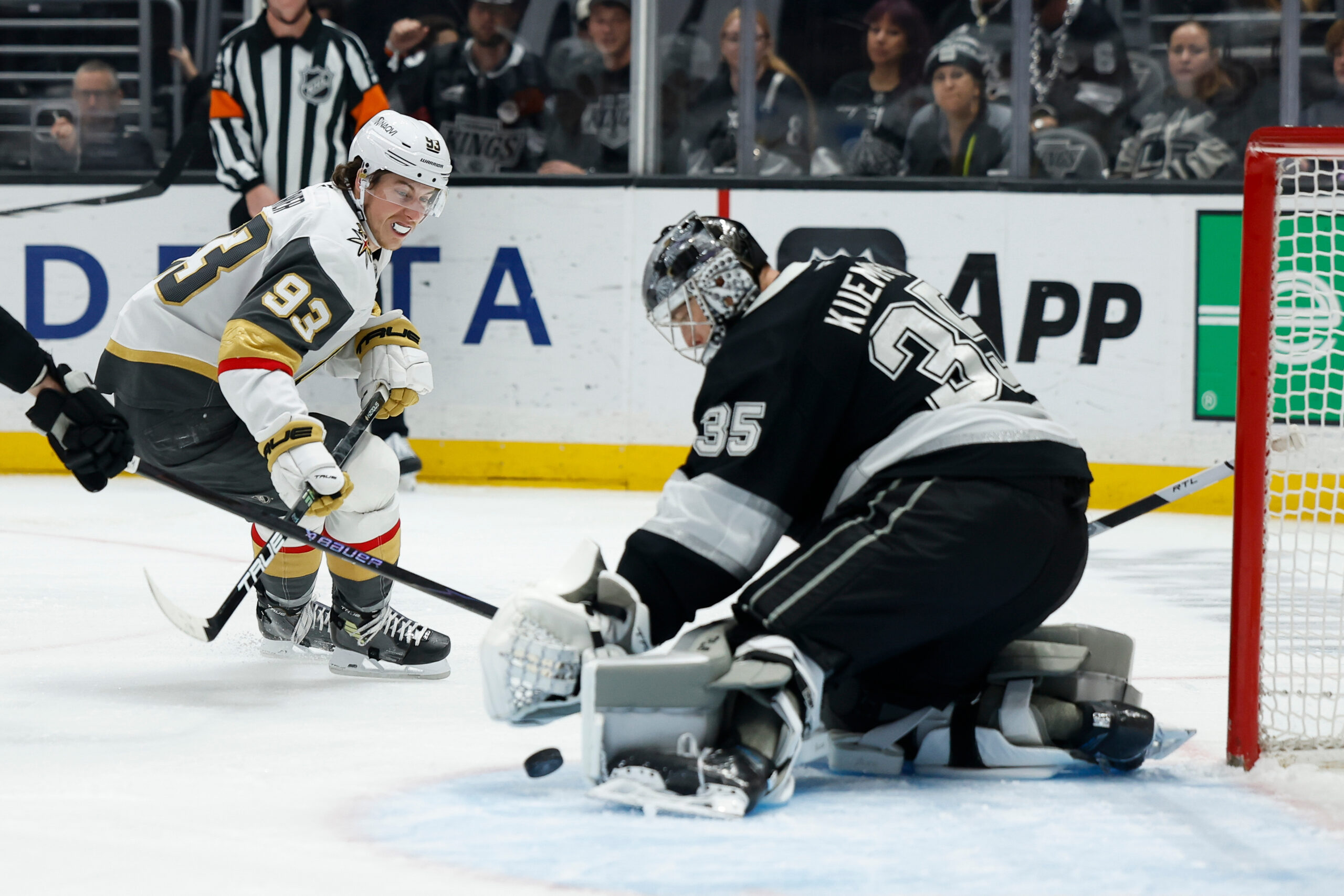 Vegas Golden Knights right wing Mitch Marner, left, takes a...