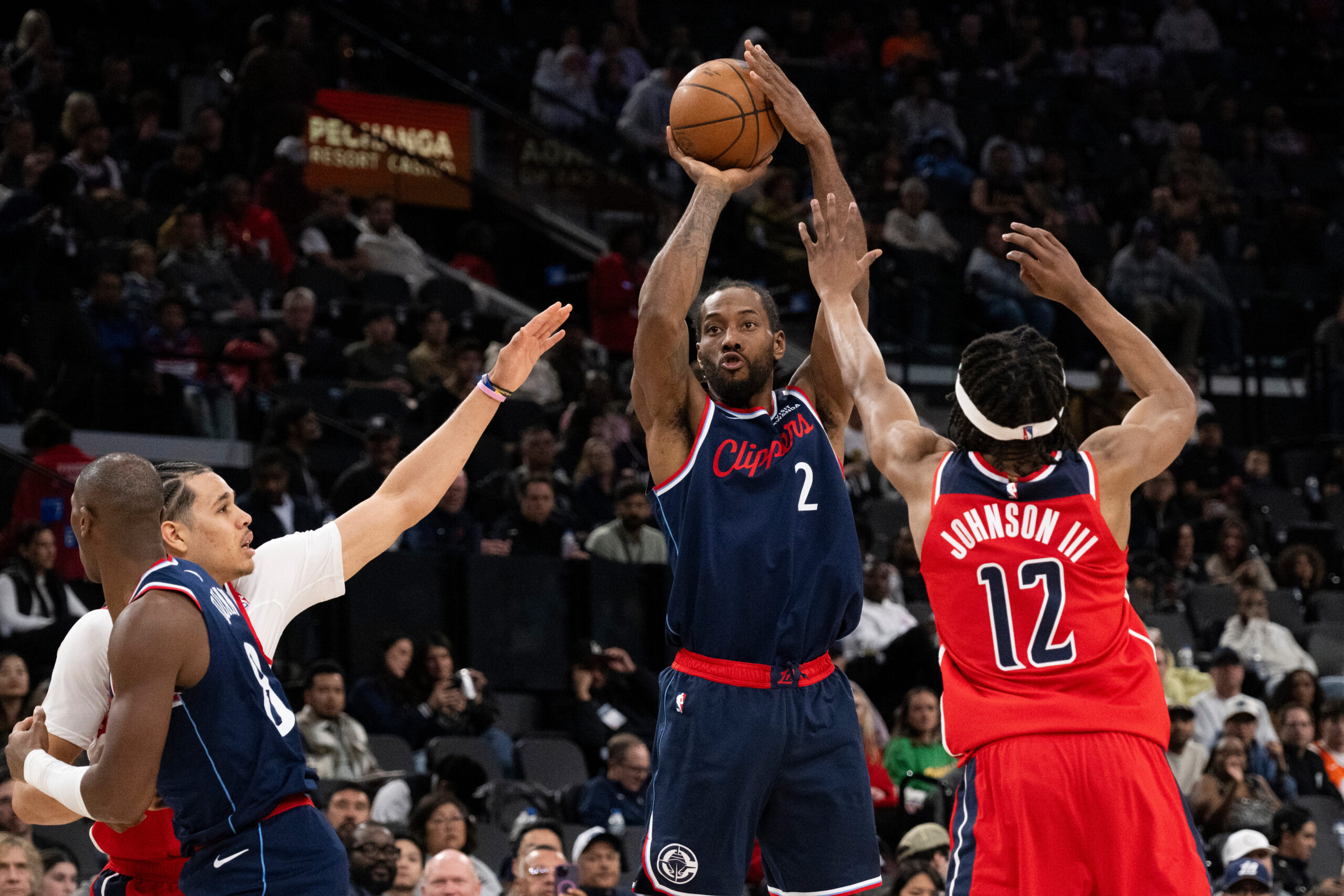 Clippers star Kawhi Leonard shoots as Washington Wizards guard Tre...