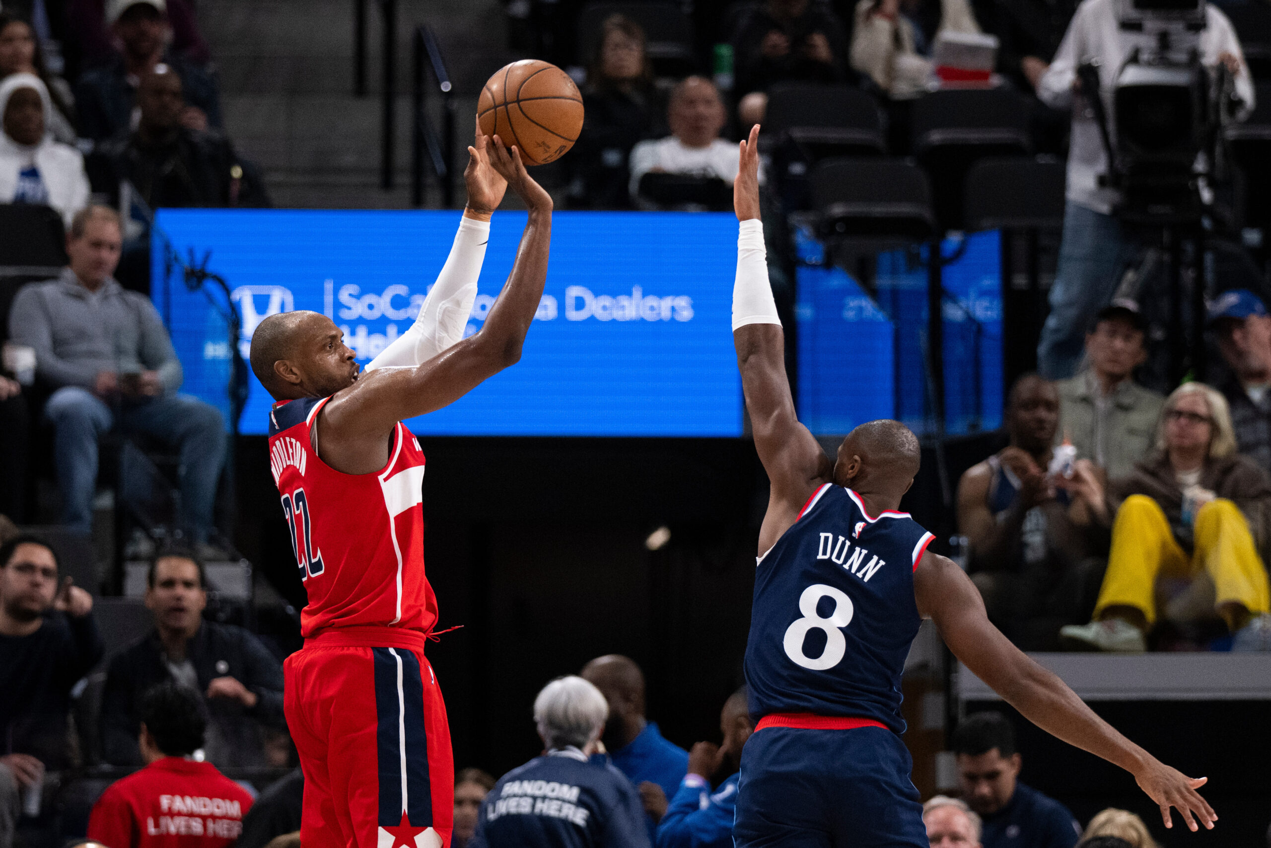Washington Wizards forward Khris Middleton shoots as Clippers guard Kris...