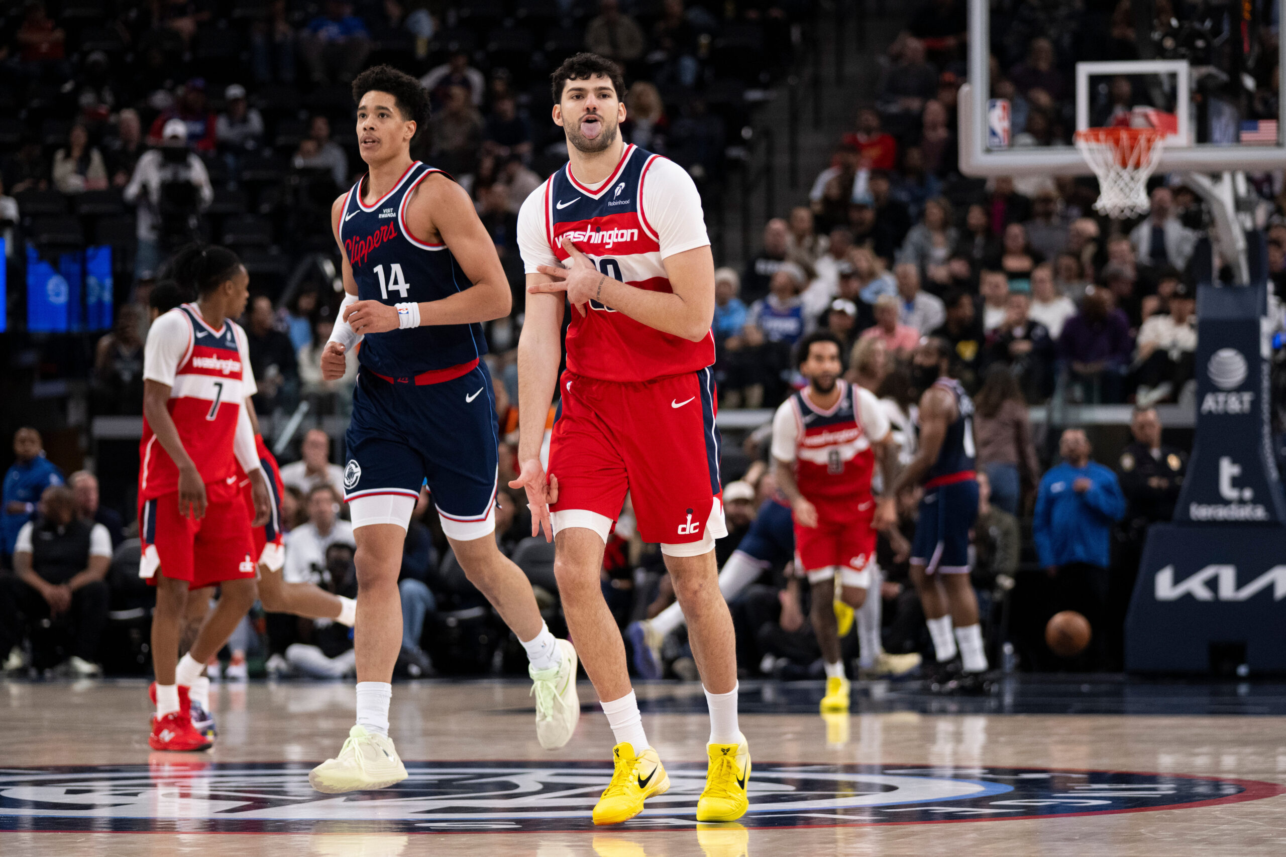 Washington Wizards forward Tristan Vukcevic gestures after scoring during the...