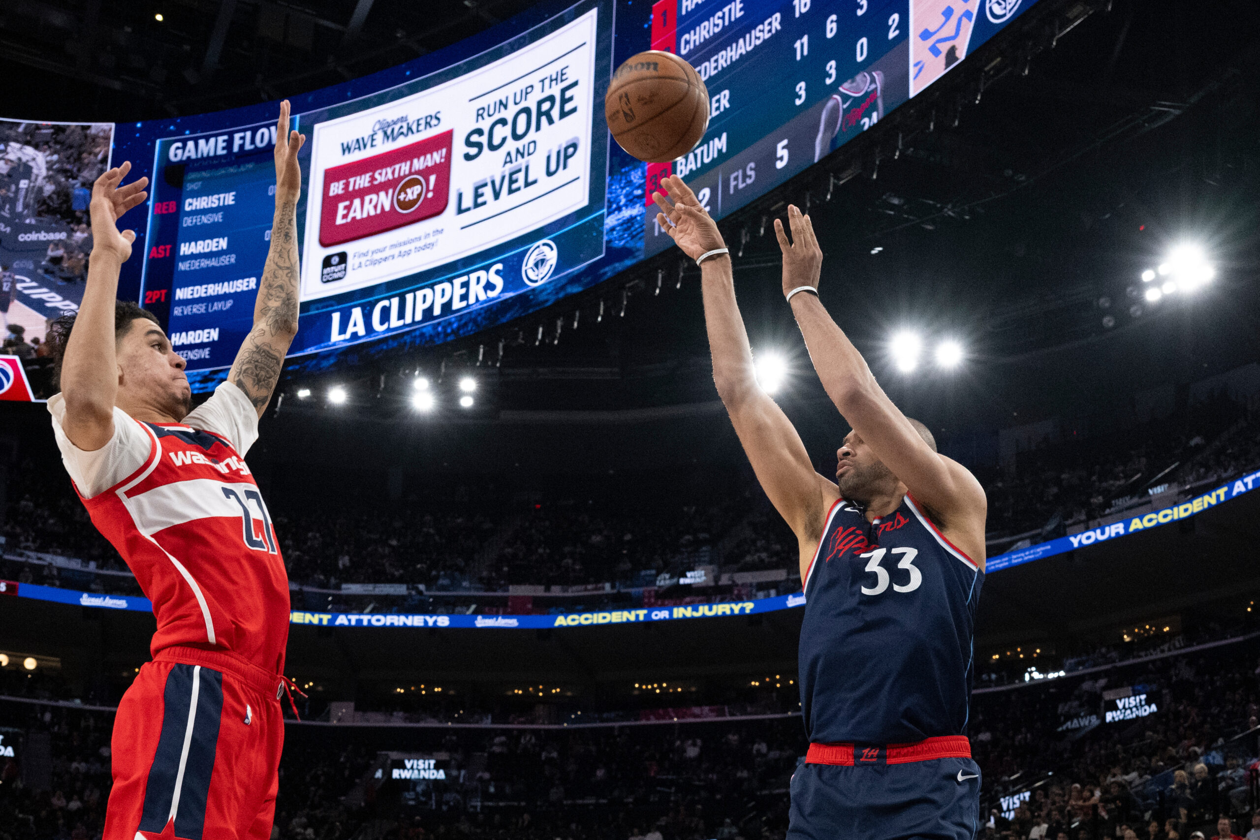 Clippers forward Nicolas Batum shoots as Washington Wizards guard Will...