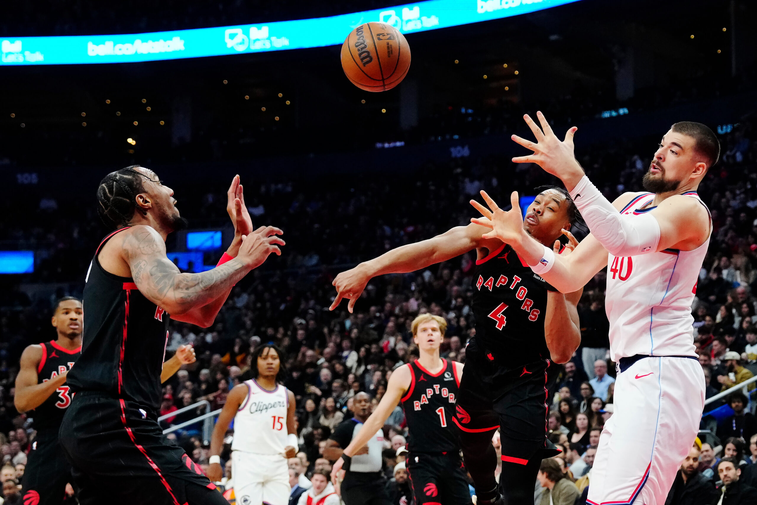 The Toronto Raptors’ A.J. Lawson, front left, and Scottie Barnes...