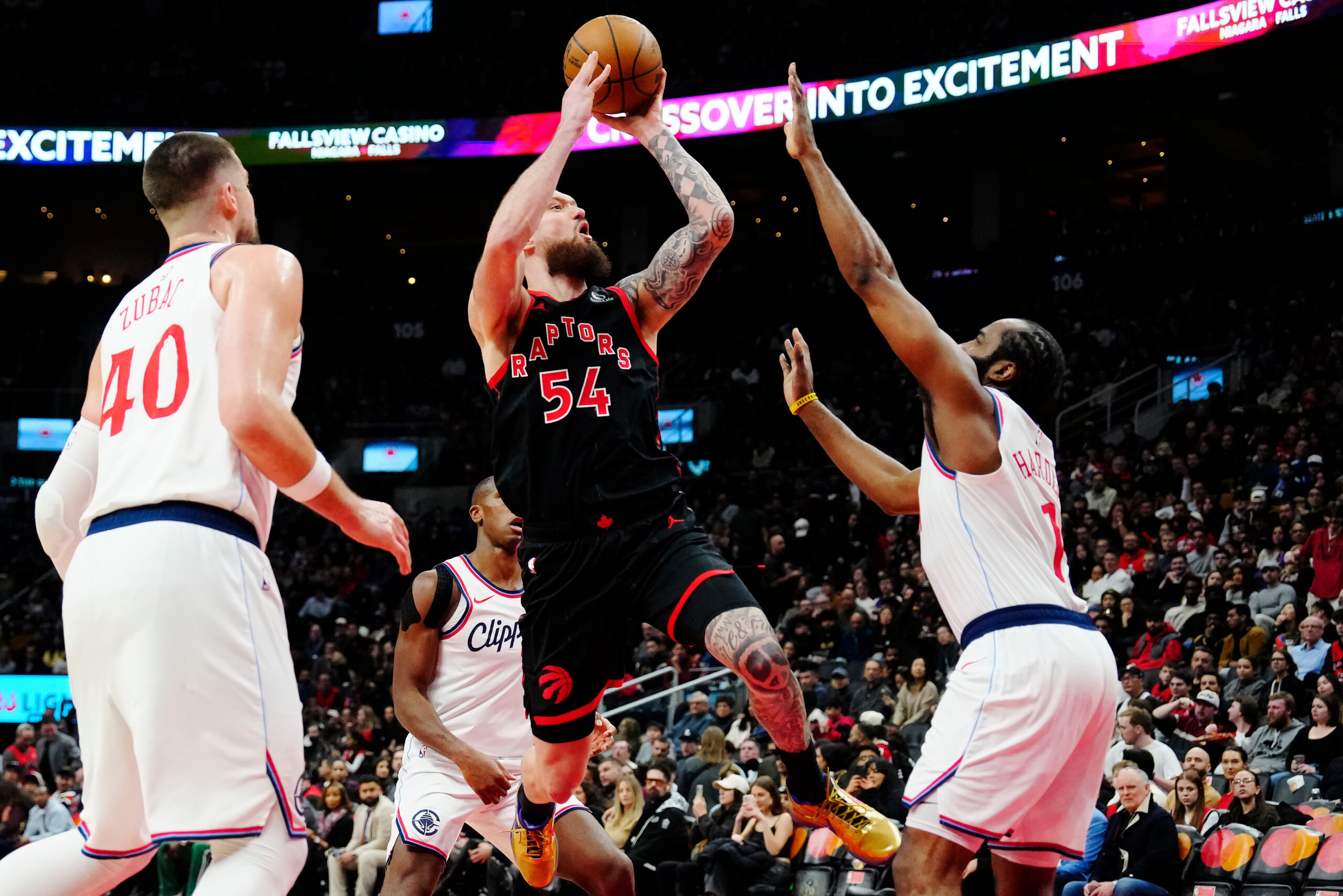 The Toronto Raptors’ Sandro Mamukelashvili (54) goes up to shoot...