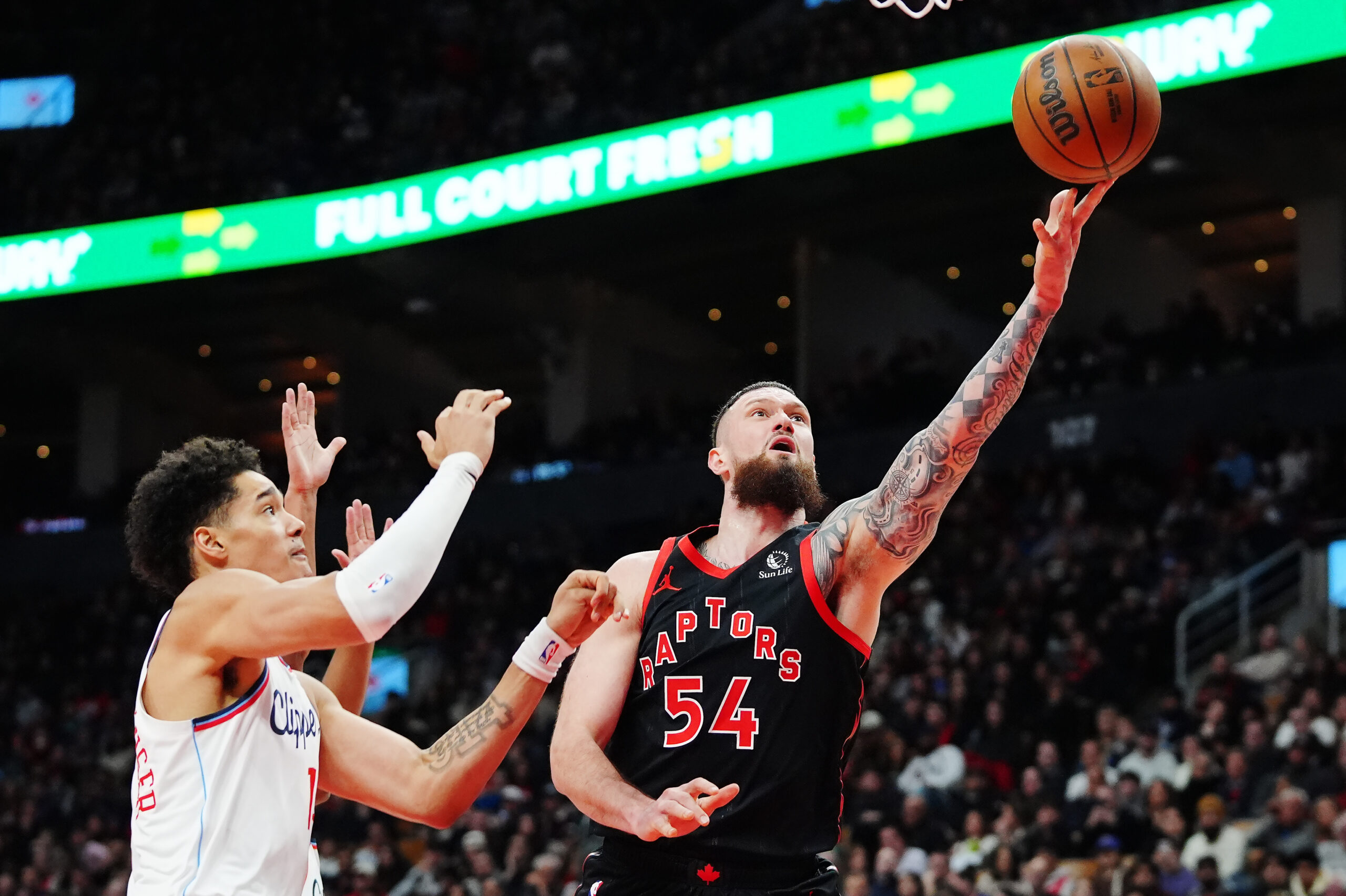 The Toronto Raptors’ Sandro Mamukelashvili shoots as Clippers rookie center...