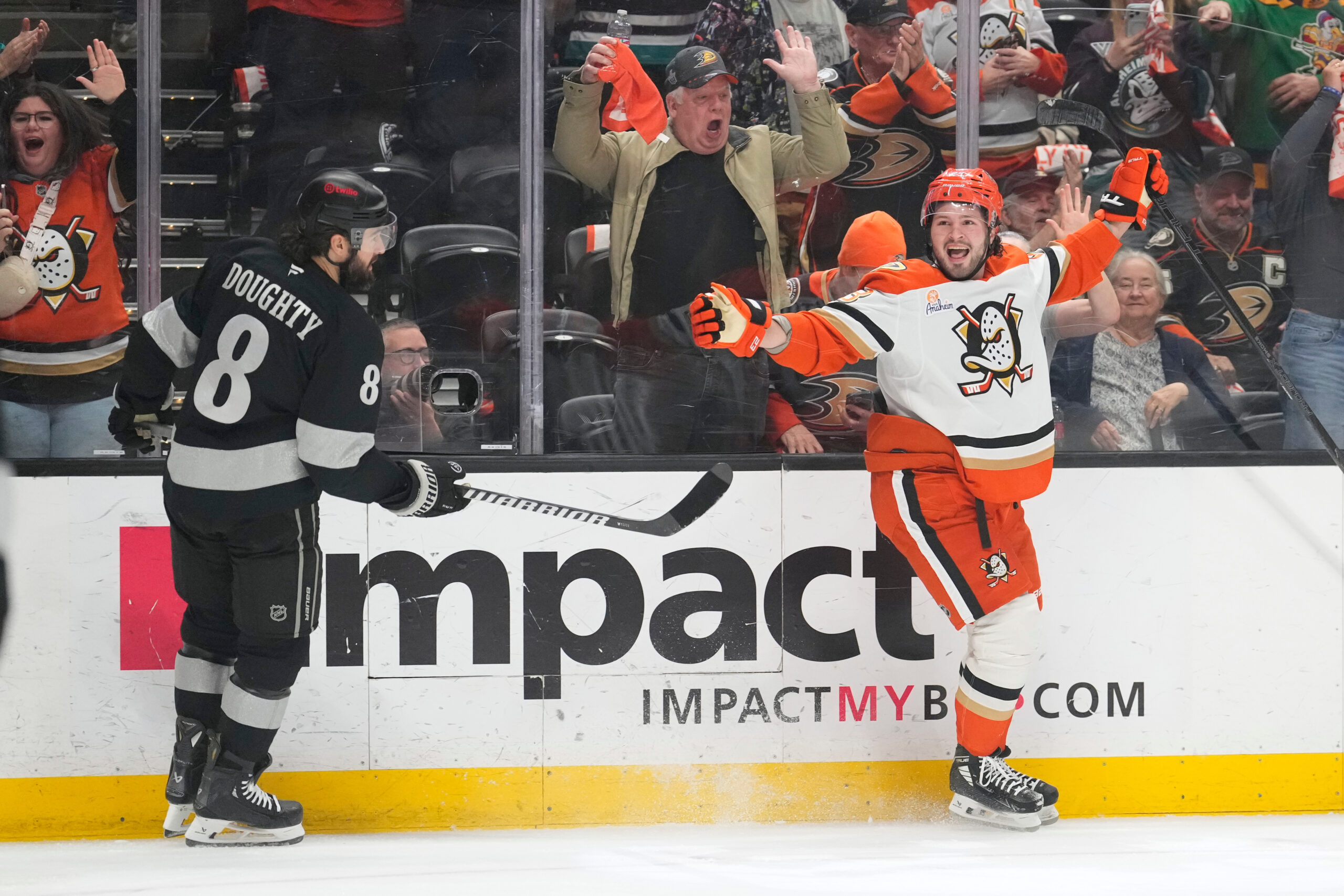 Ducks center Mason McTavish, right celeb rates his goal as...