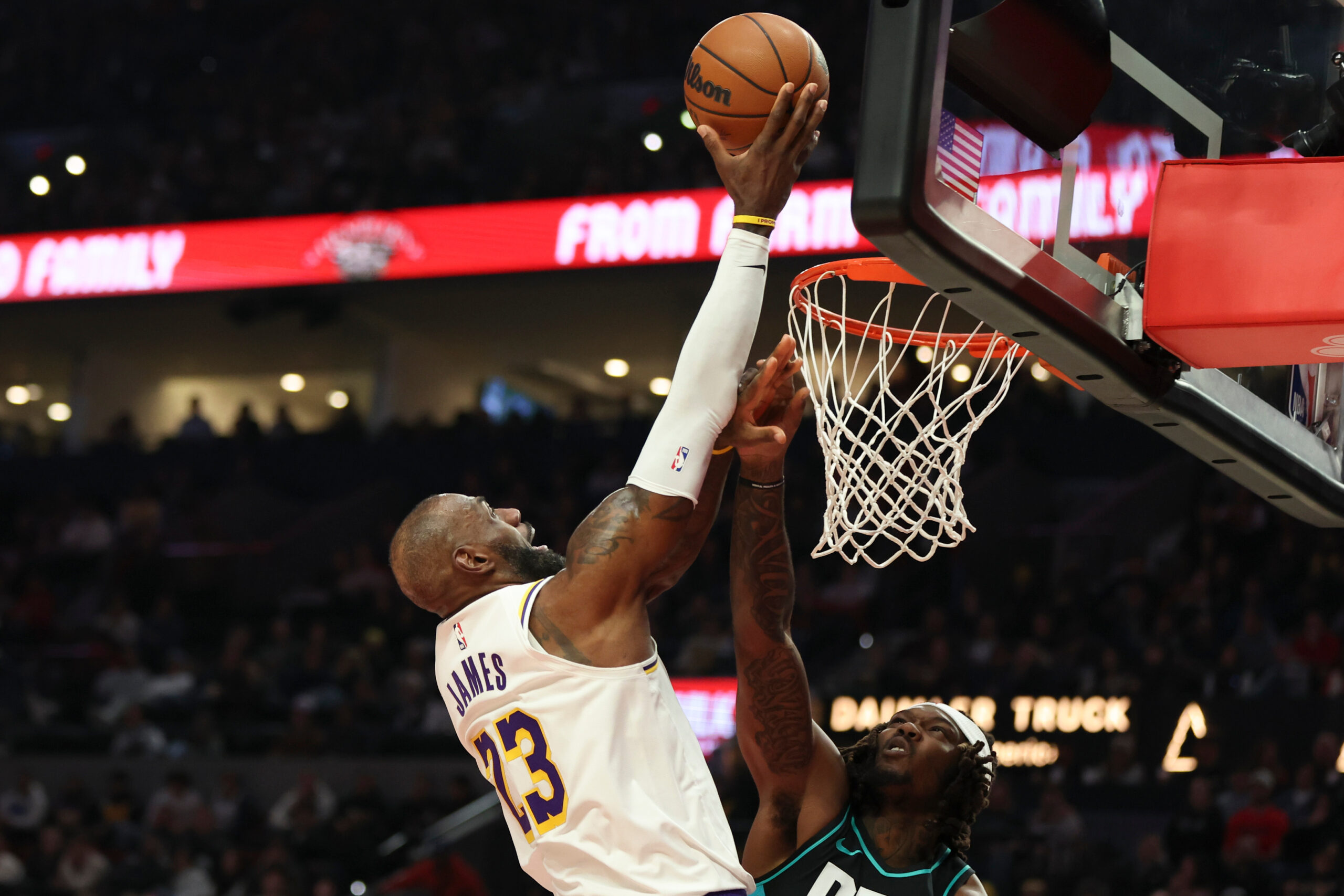 Lakers forward LeBron James (23) drives to the basket as...