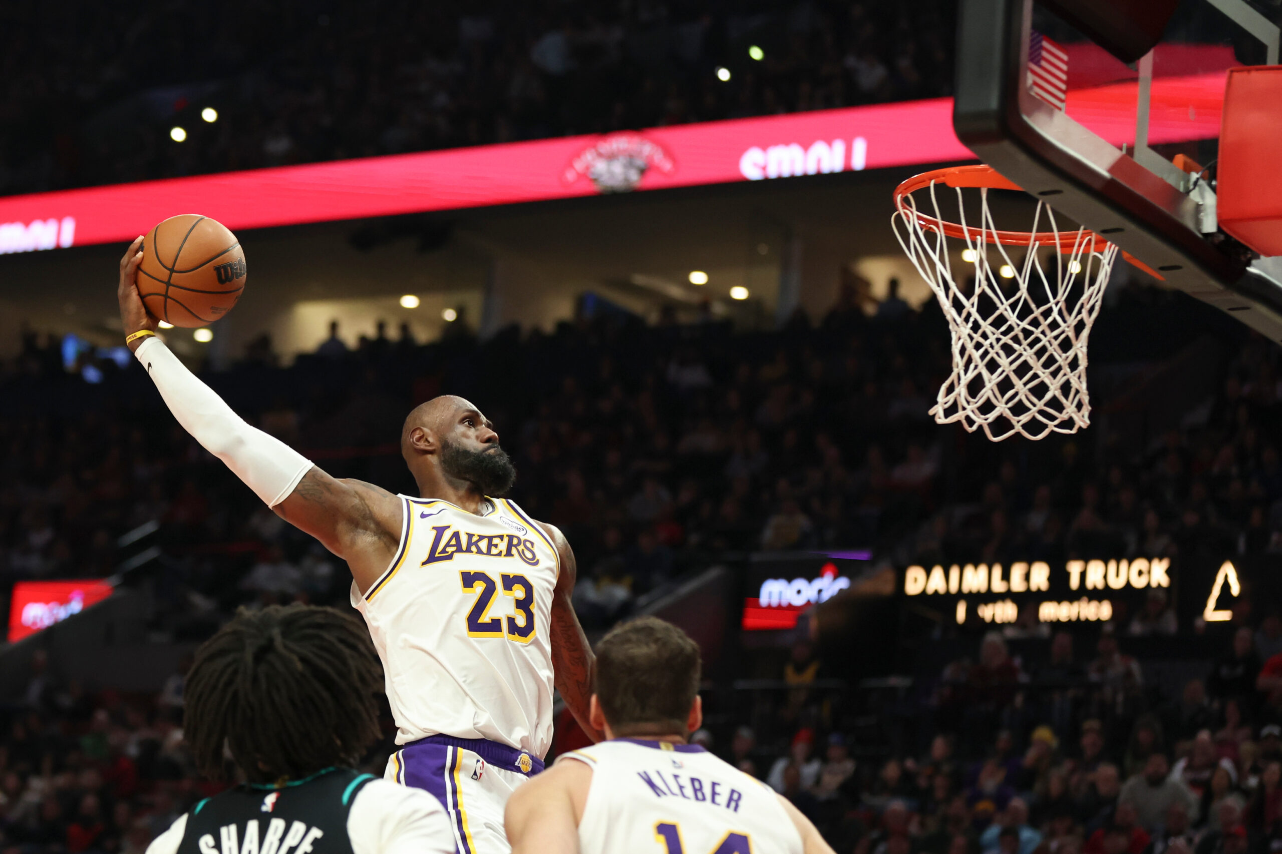 Lakers forward LeBron James (23) dunks against the Portland Trail...
