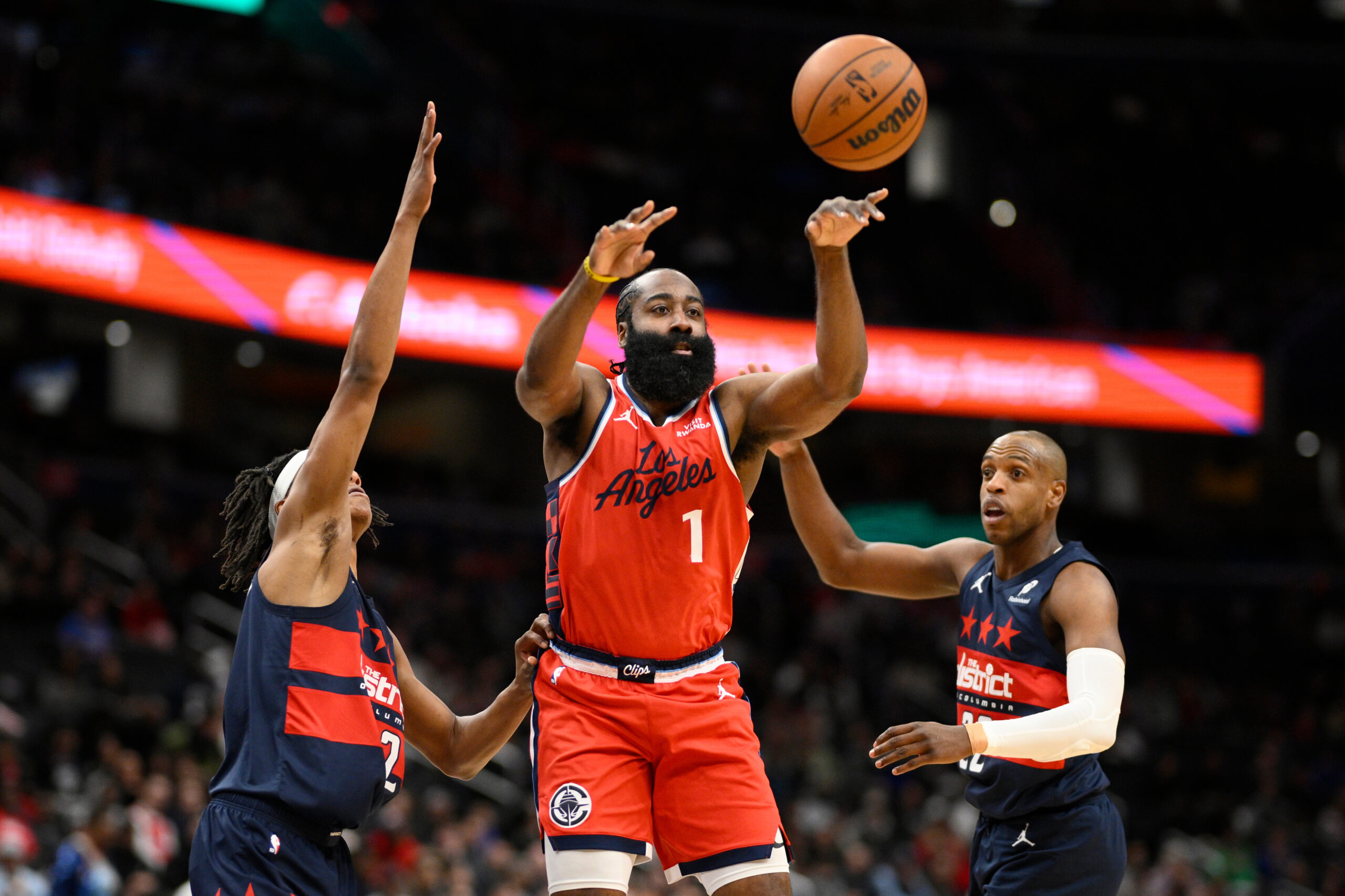 Clippers guard James Harden passes the ball as Washington Wizards...