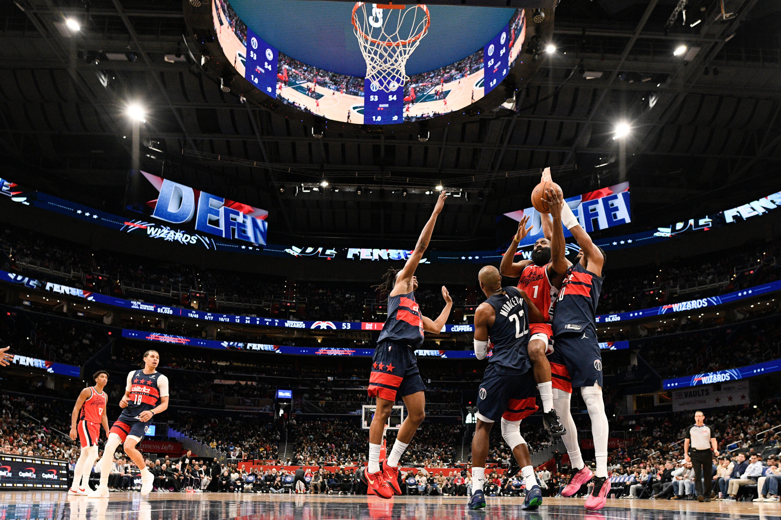 Clippers guard James Harden (1) goes to the basket as...