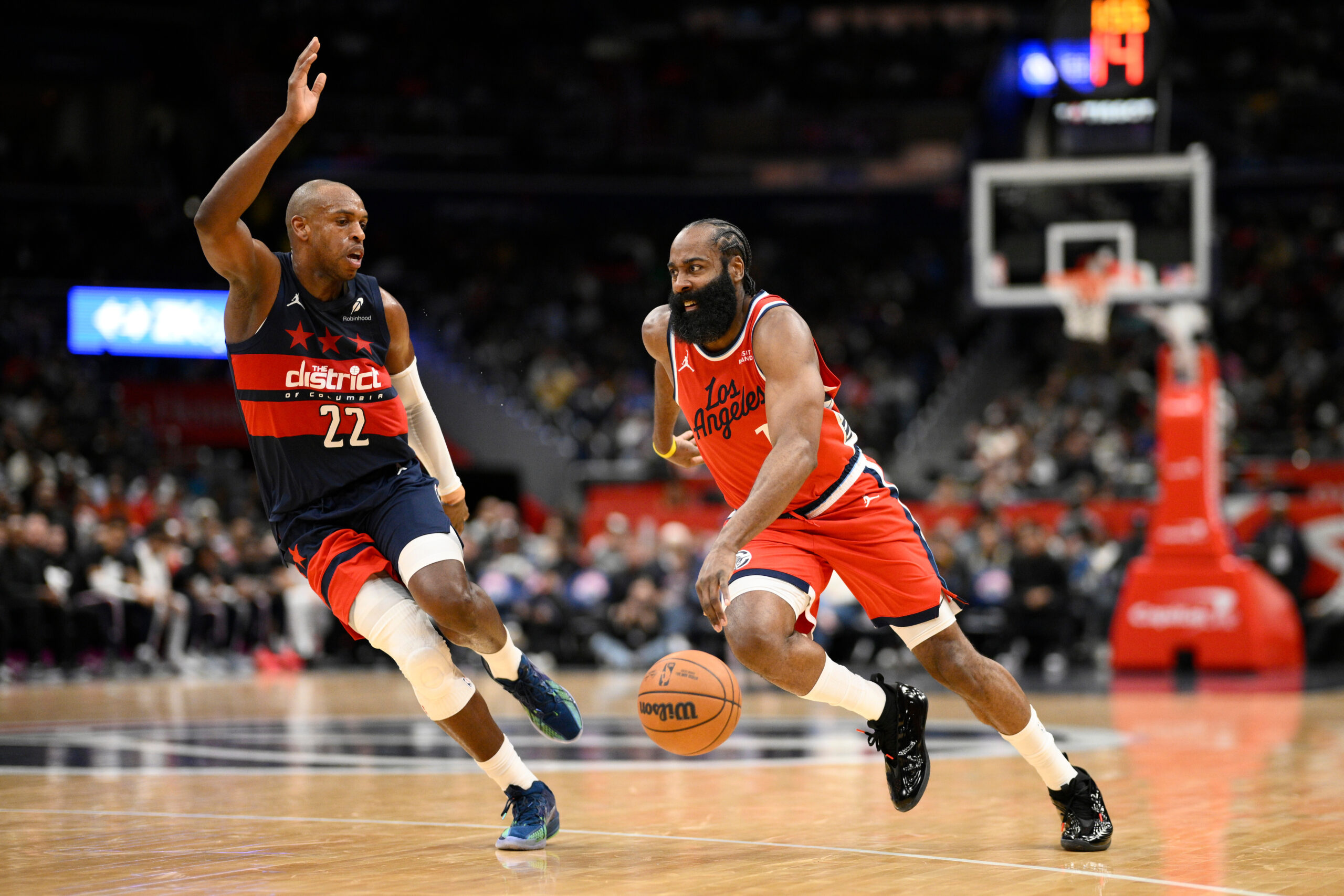 Clippers guard James Harden drives as Washington Wizards forward Khris...
