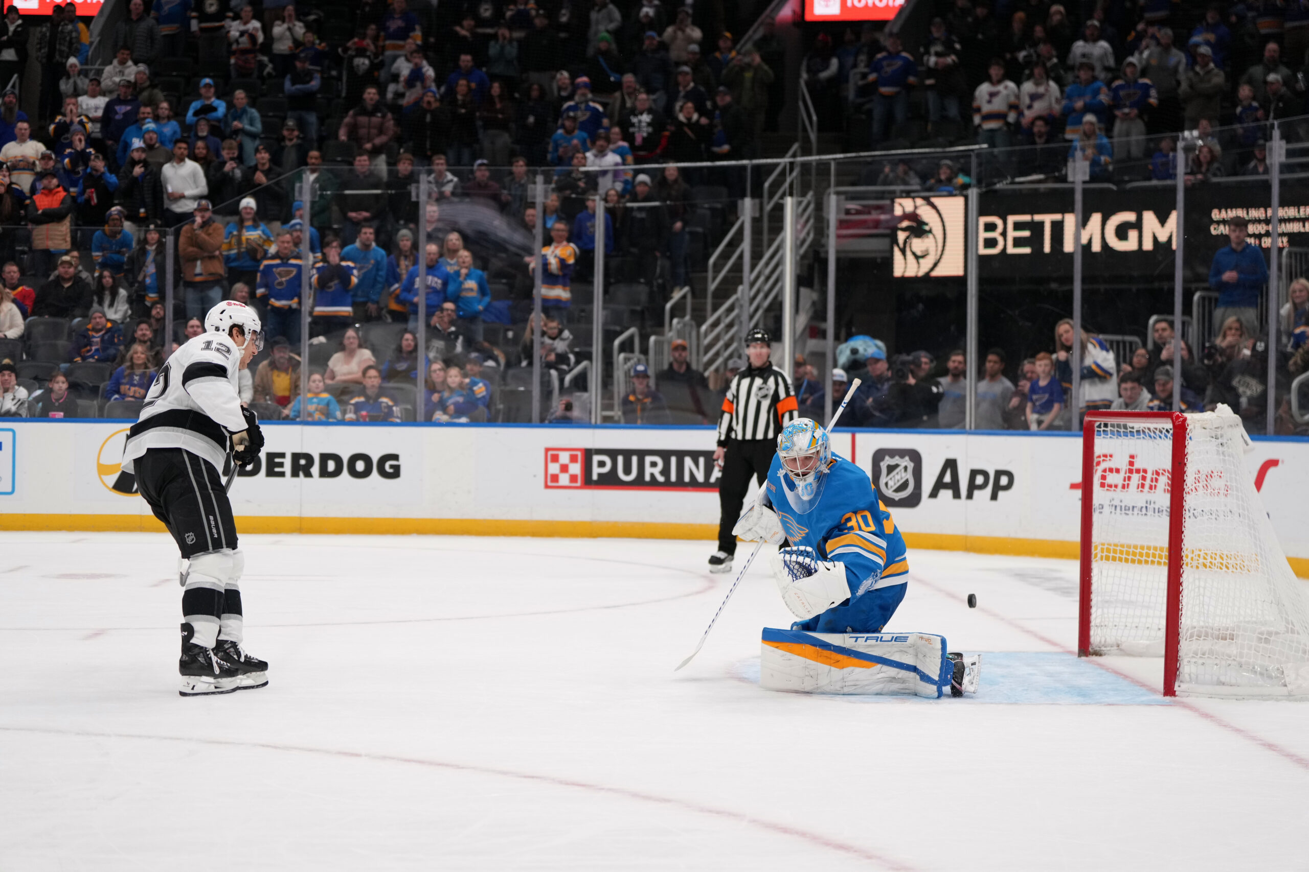 Kings’ Trevor Moore (12) scores past St. Louis Blues goaltender...