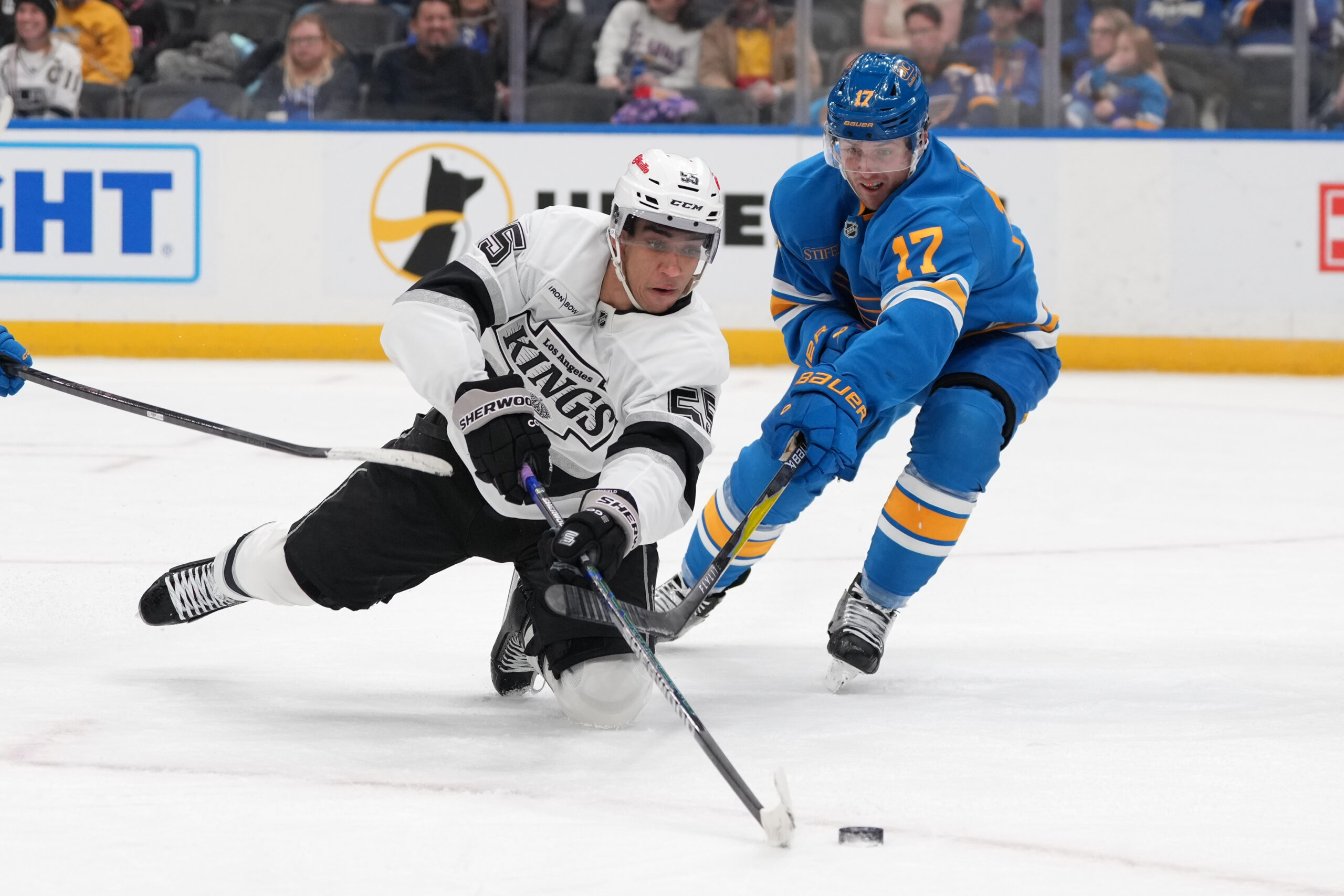 Kings’ Quinton Byfield (55) and St. Louis Blues’ Cam Fowler...