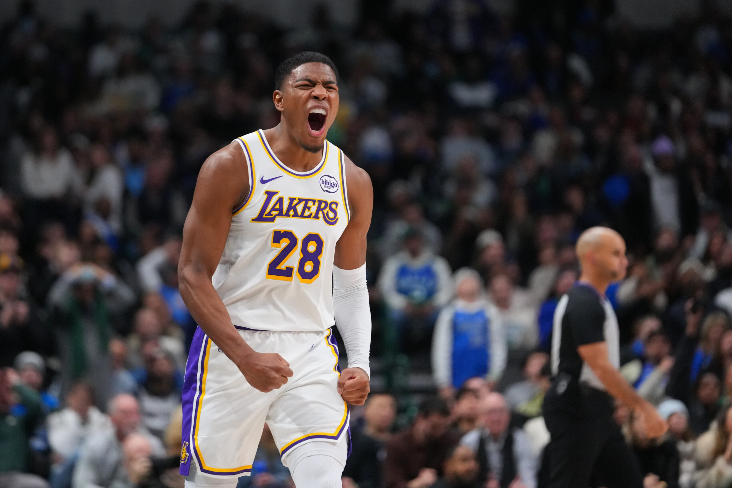 Lakers forward Rui Hachimura reacts after scoring a shot against...