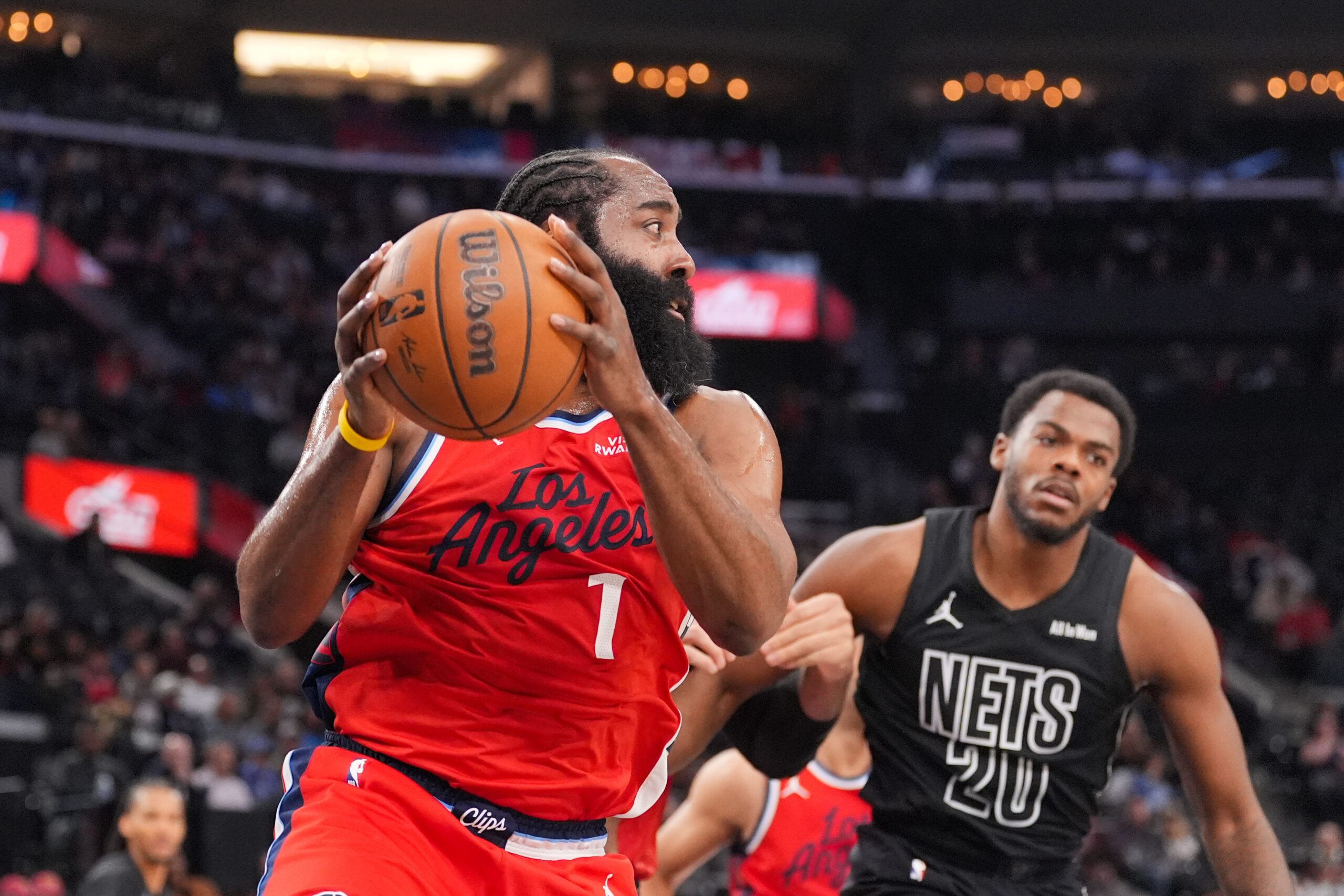 Clippers guard James Harden (1) grabs a rebound during the...