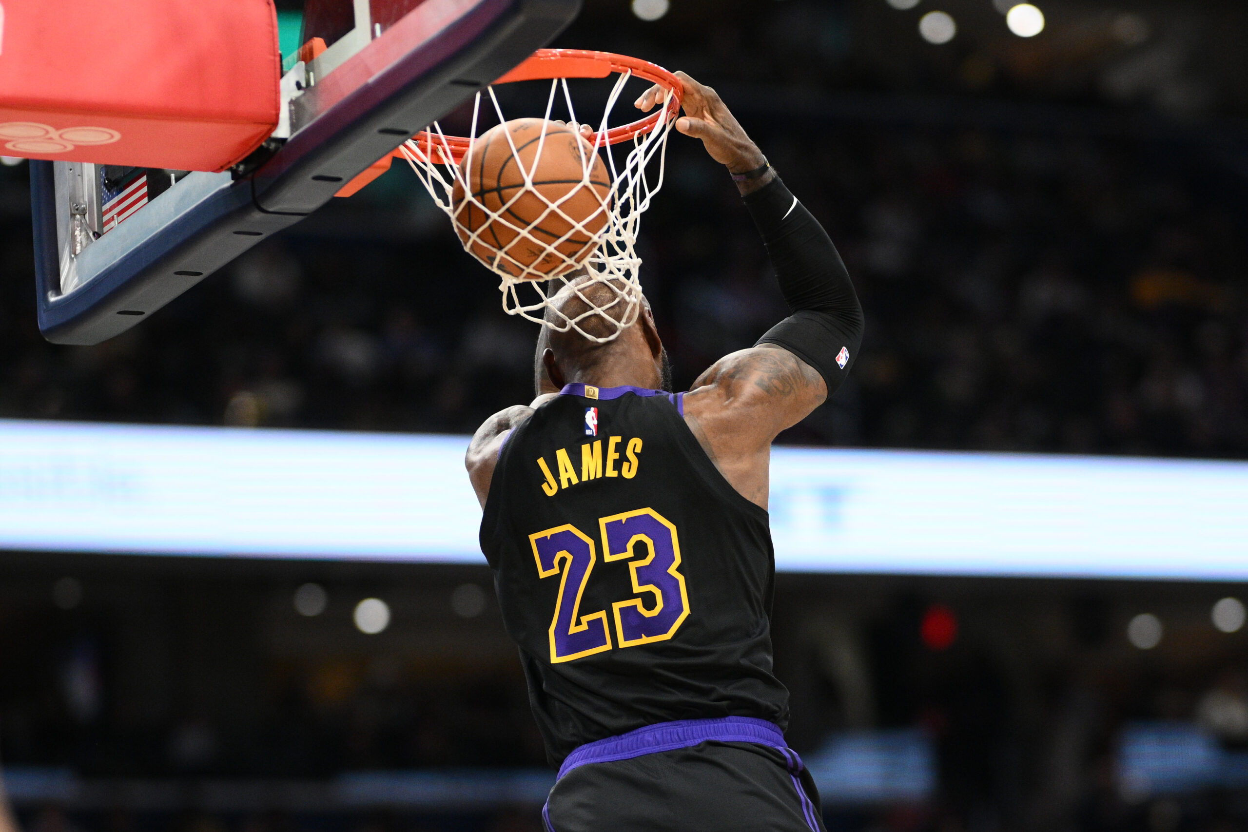 Lakers star LeBron James does a reverse dunk during the...