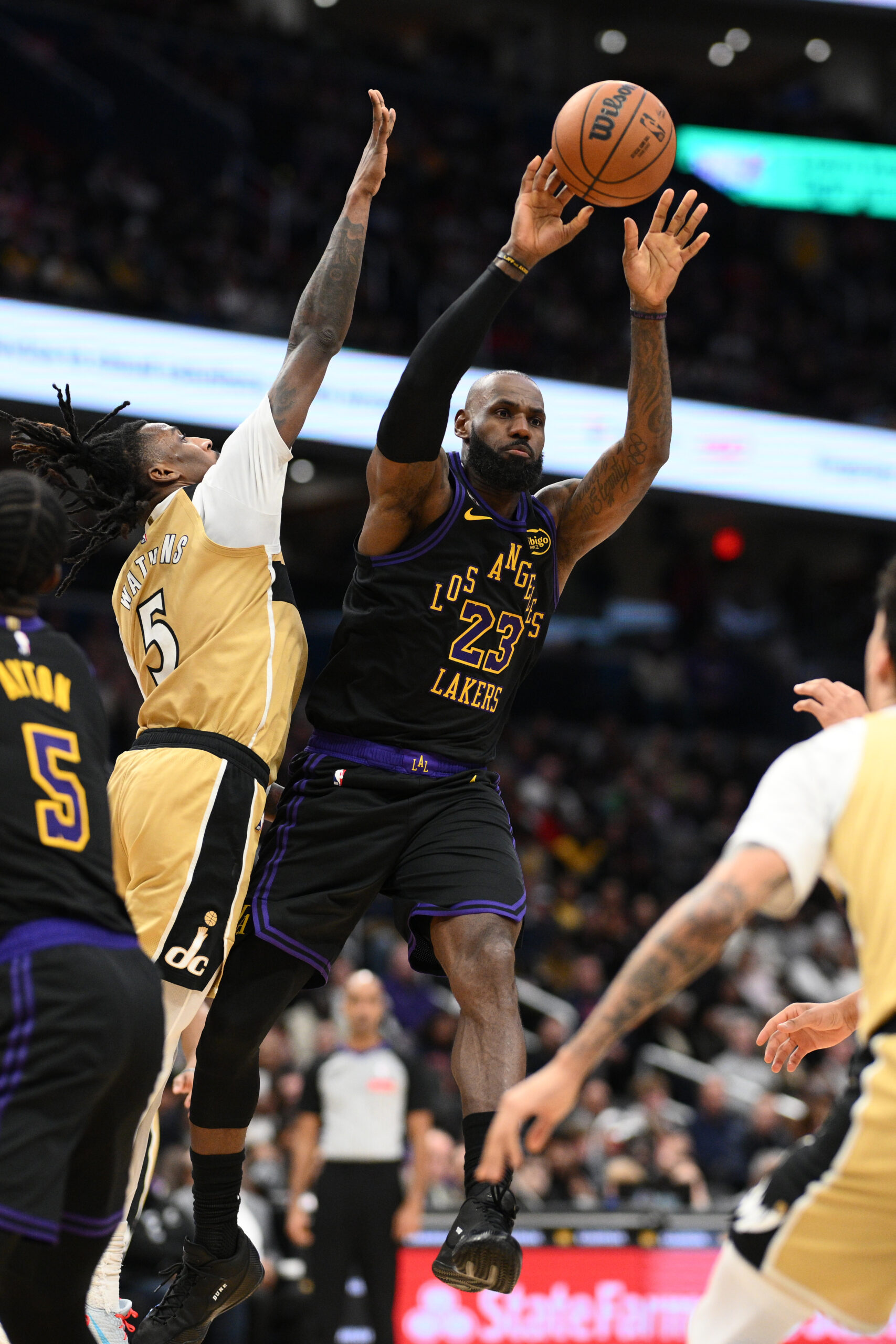 Lakers forward LeBron James (23) passes the ball against Washington...