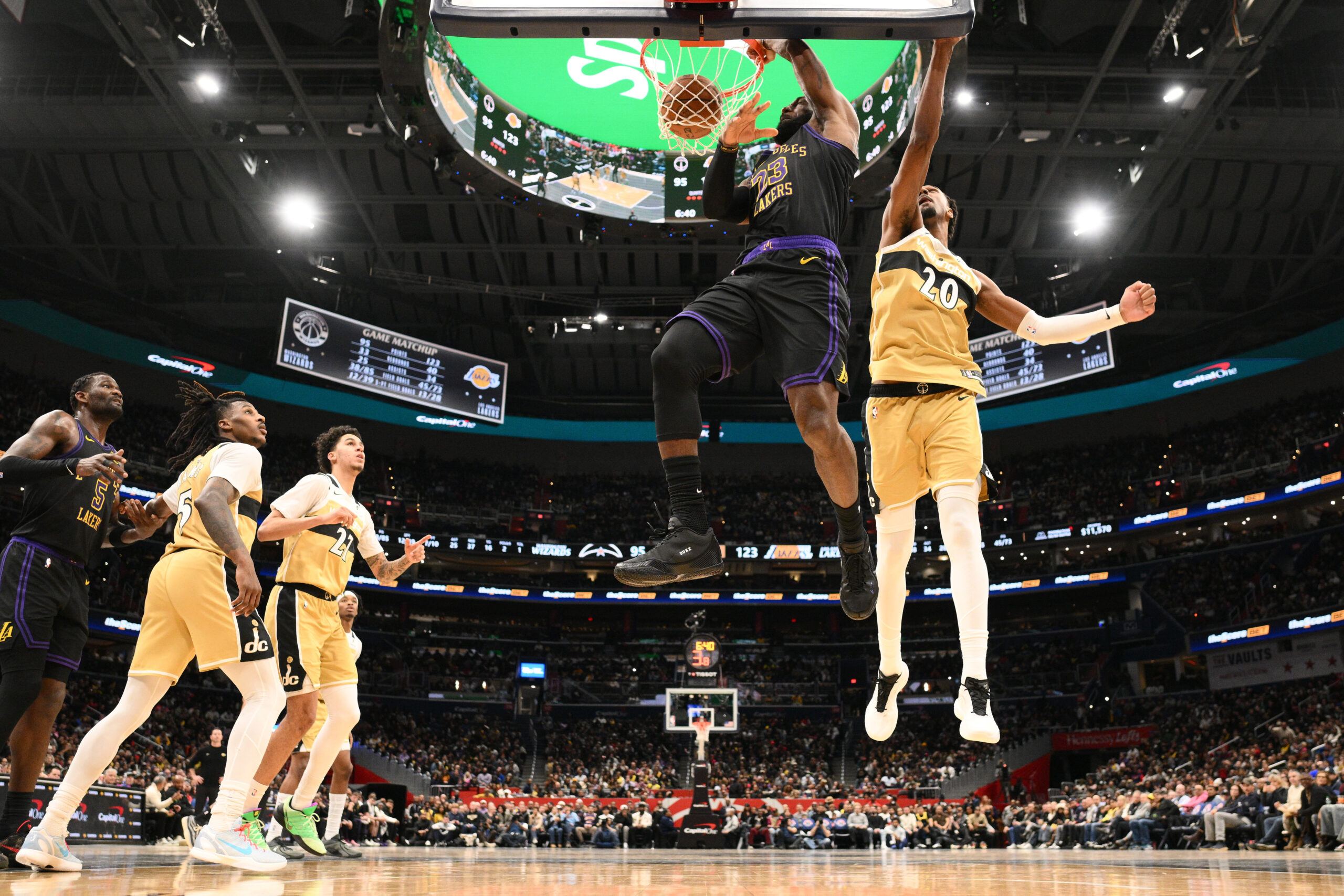 Lakers star LeBron James (23) dunks against Washington Wizards center...