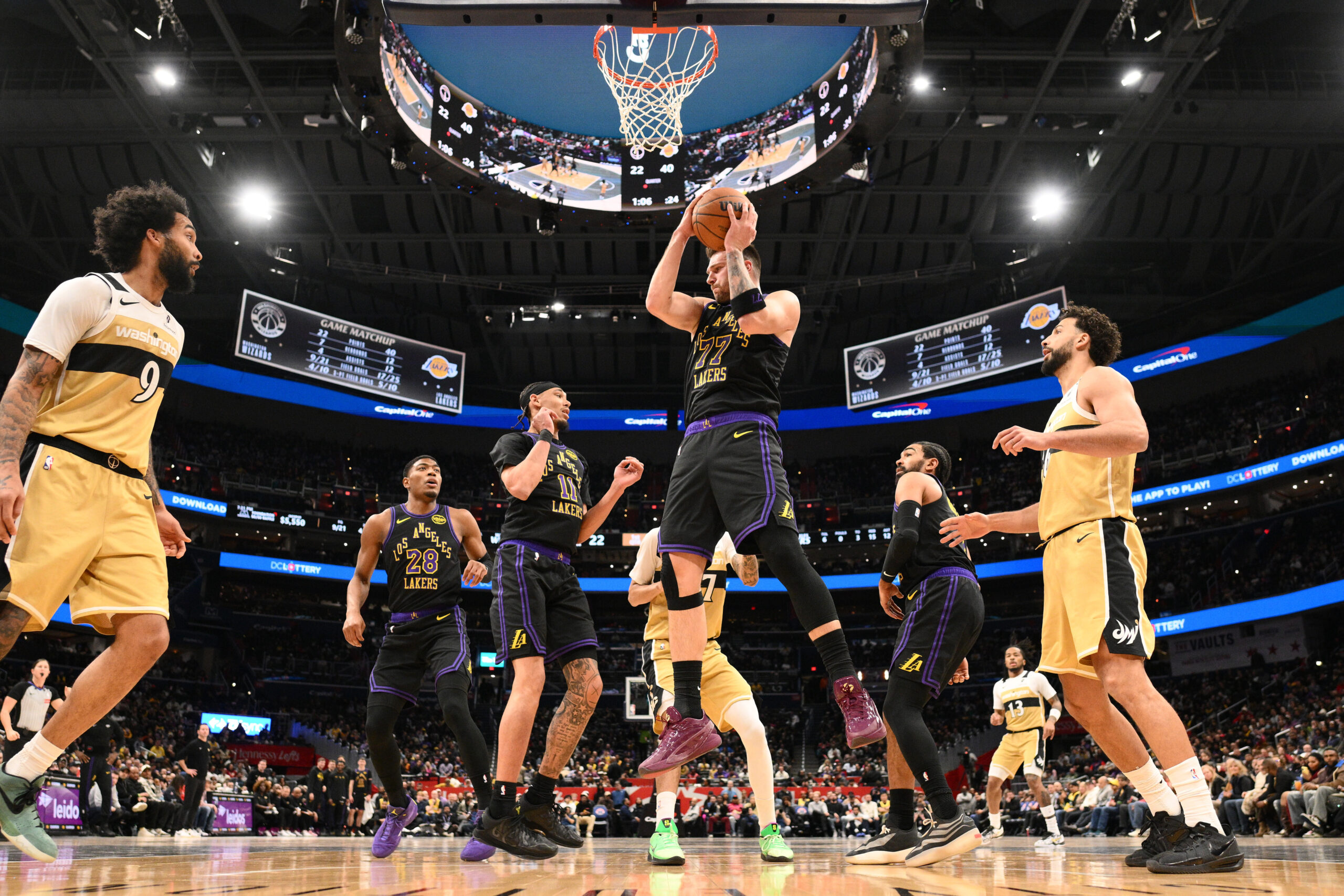 Lakers star Luka Doncic (77) grabs the ball during the...