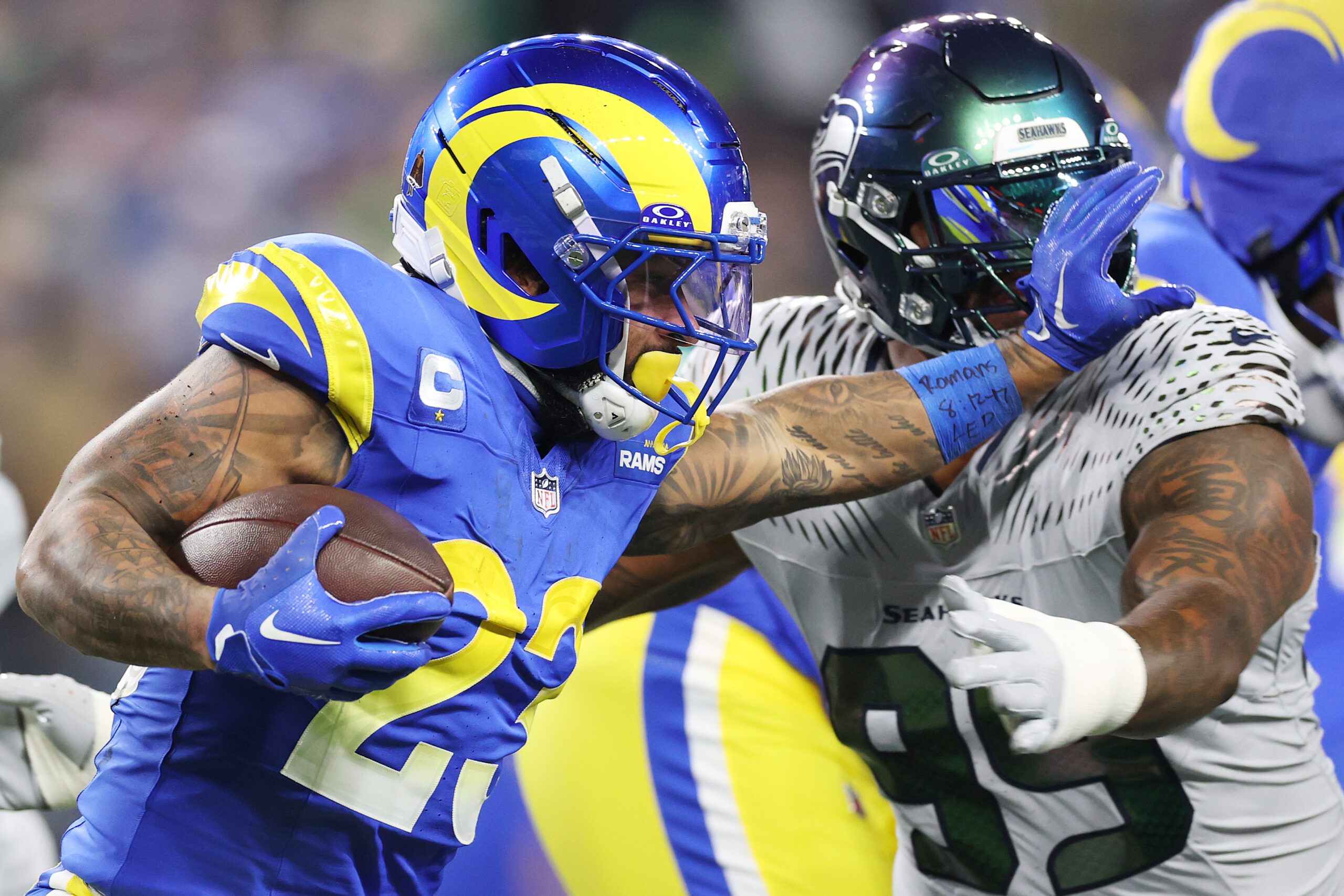 Rams running back Kyren Williams runs with the ball as...