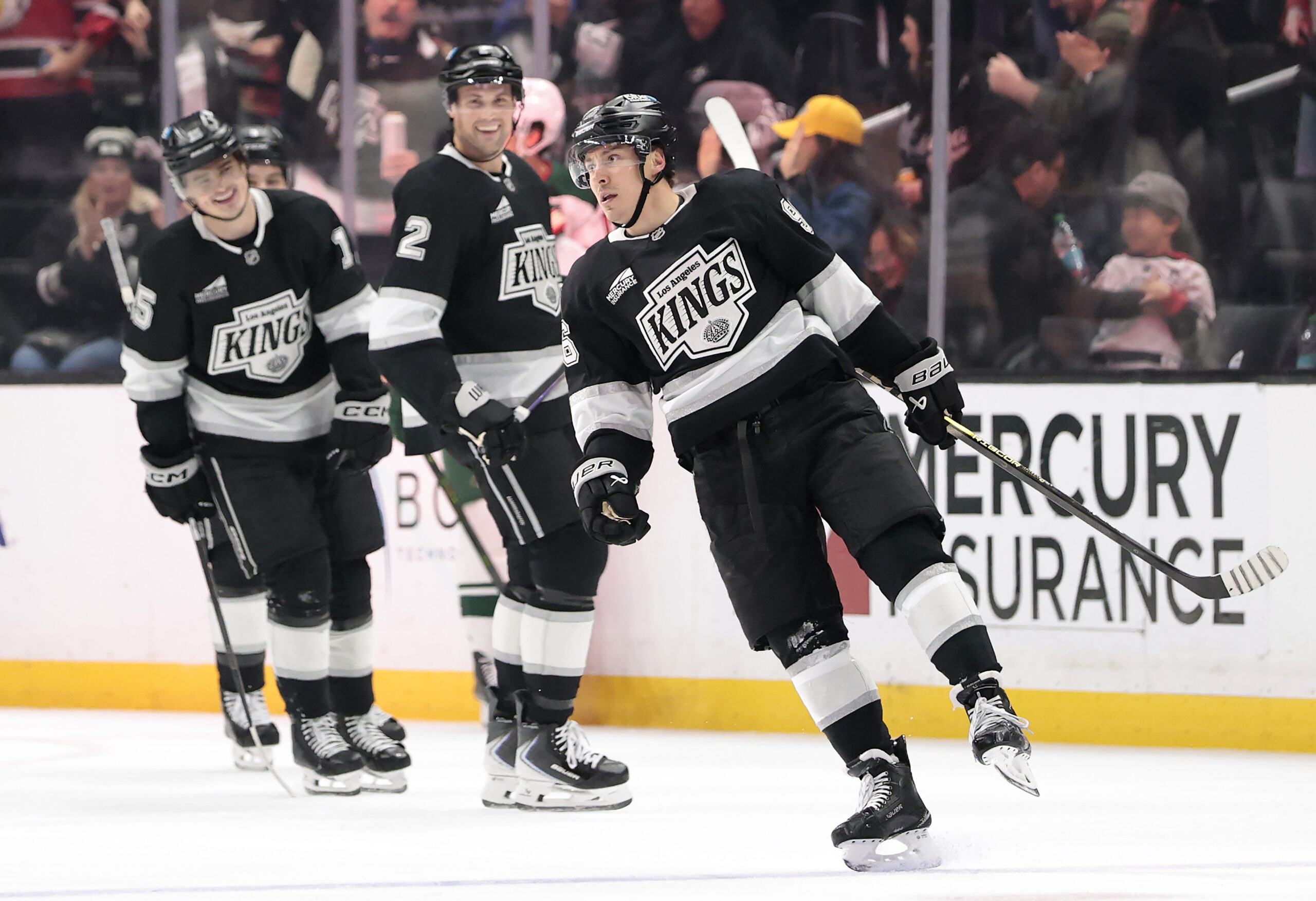 The Kings’ Andrei Kuzmenko, right, celebrates a goal during the...