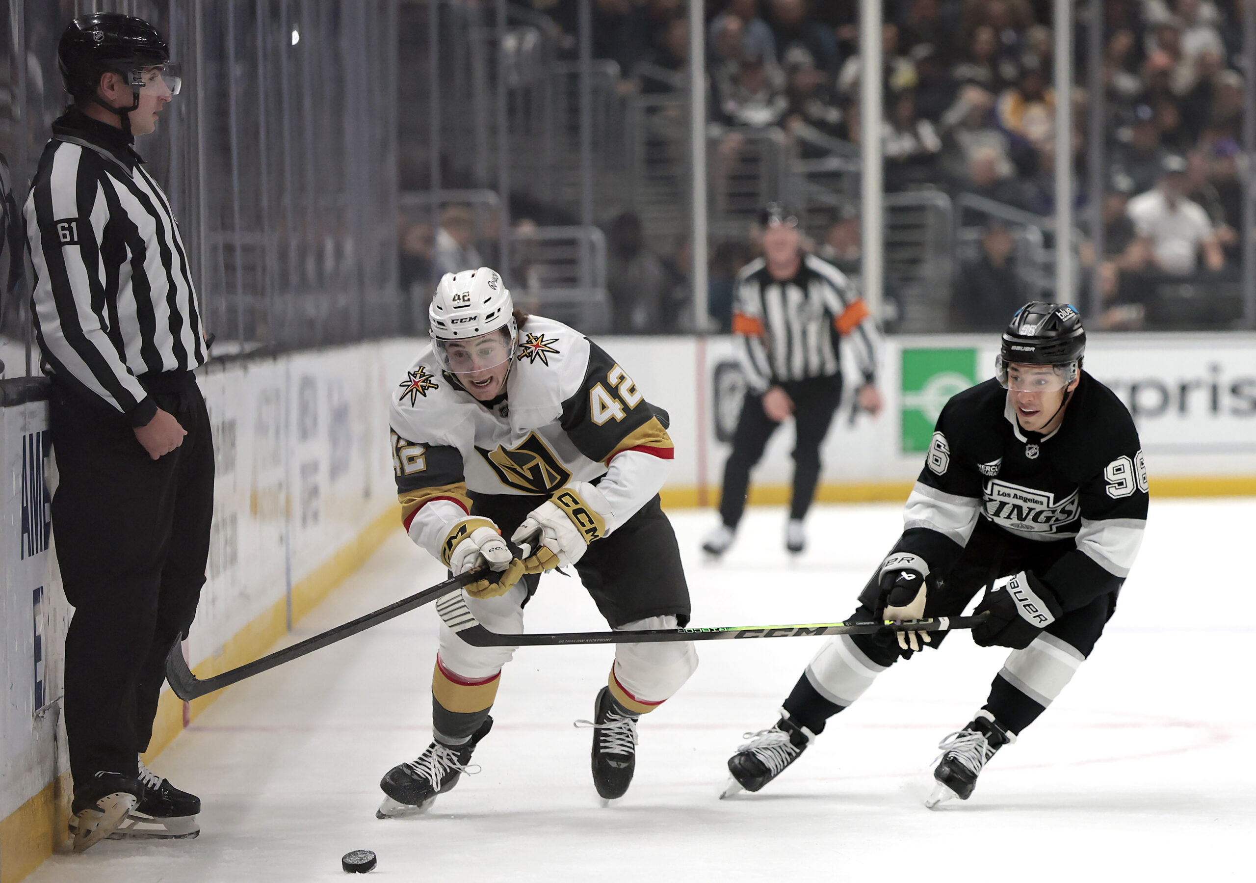 The Vegas Golden Knights’ Braeden Bowman, left, pursues the puck...