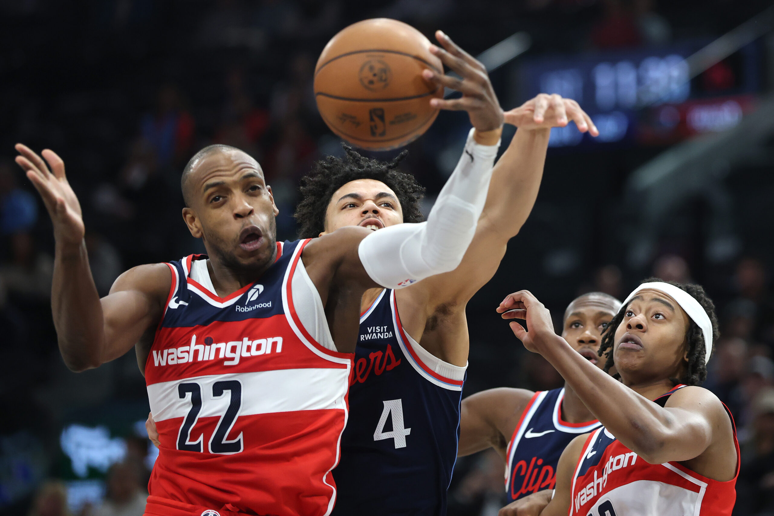 The Washington Wizards’ Khris Middleton, left, and Tre Johnson, right,...