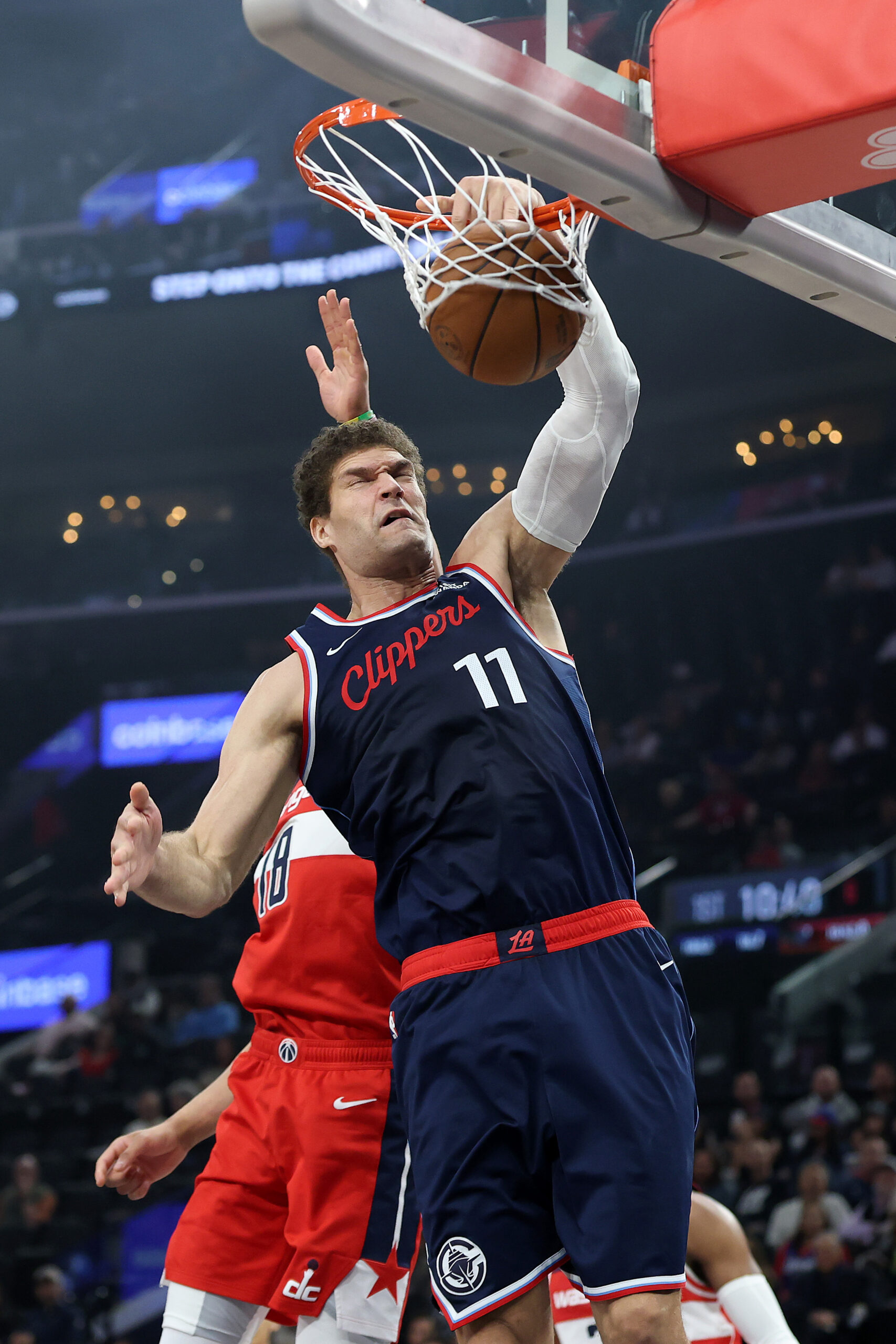 Clippers center Brook Lopez dunks during the first half of...