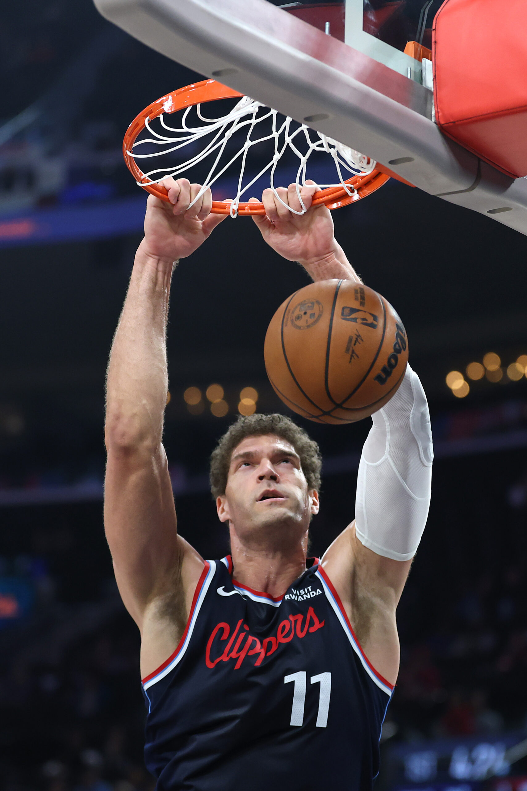 Clippers center Brook Lopez dunks during the first half of...