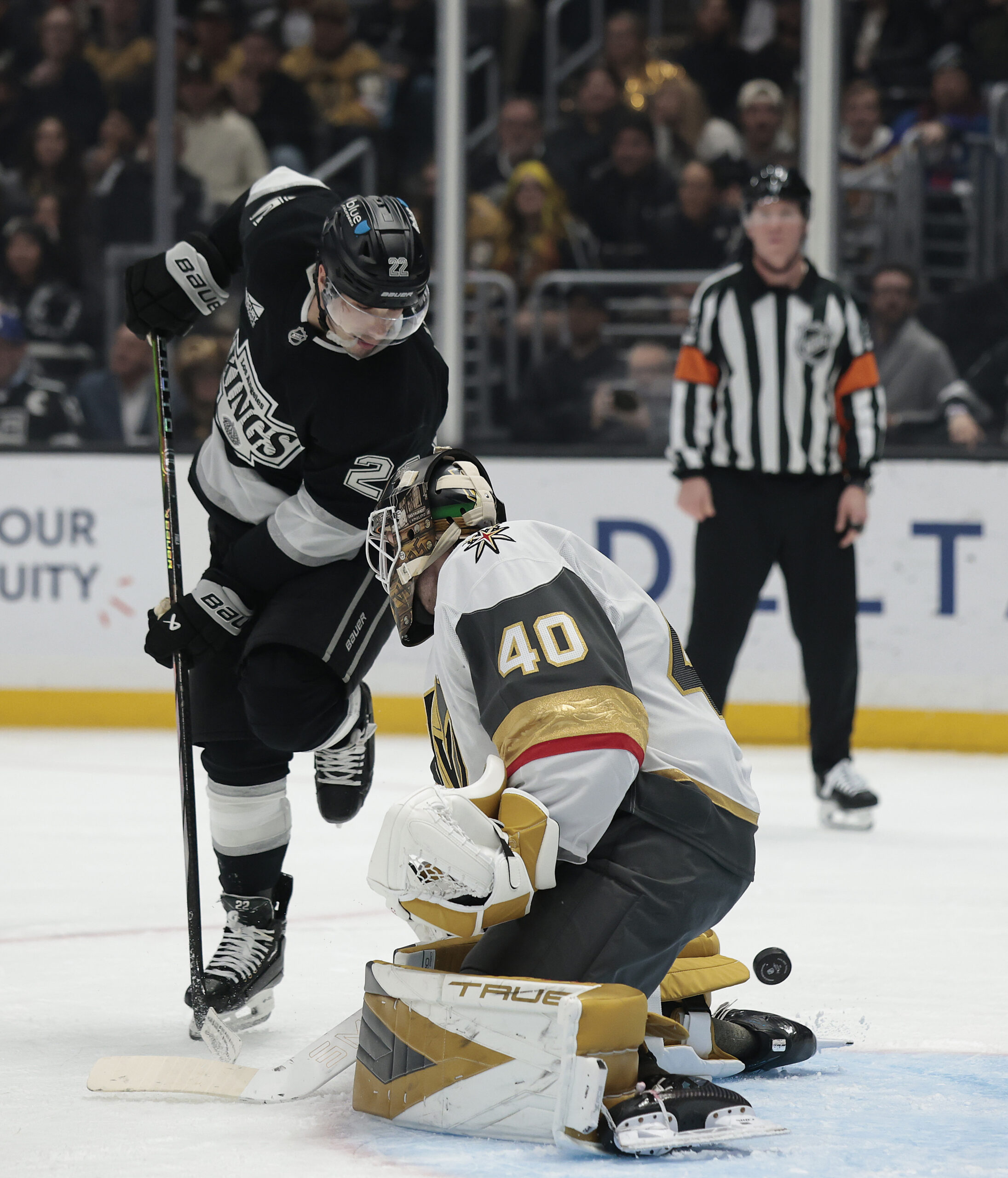 Vegas Golden Knights goaltender Akira Schmid, right, makes a save...