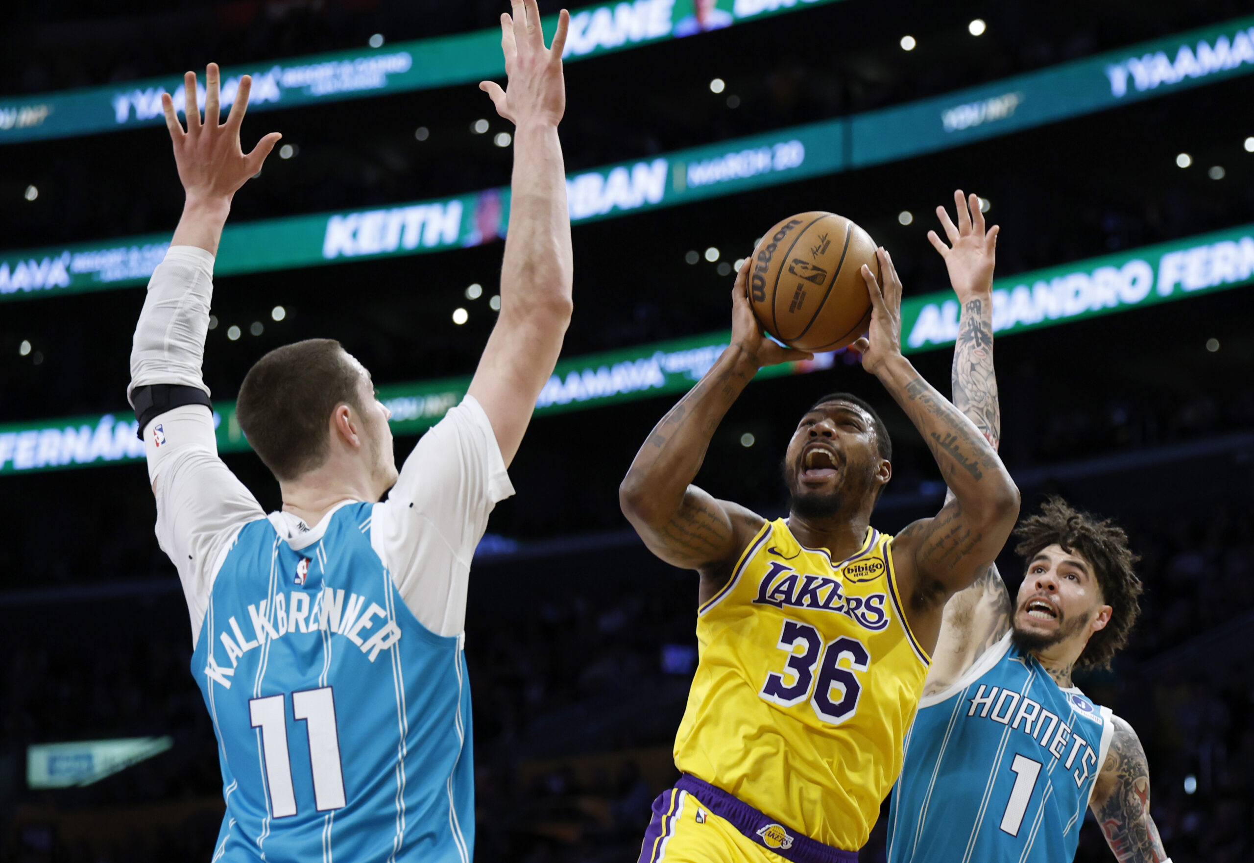 Lakers guard Marcus Smart, center, reacts as he is fouled...