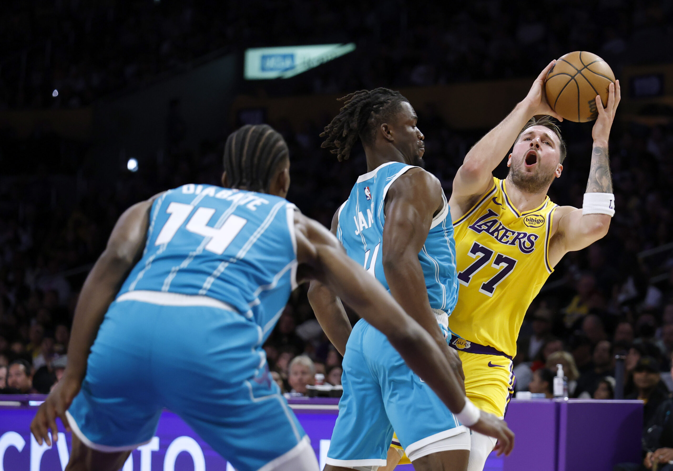 Lakers star Luka Doncic reacts as he is fouled by...