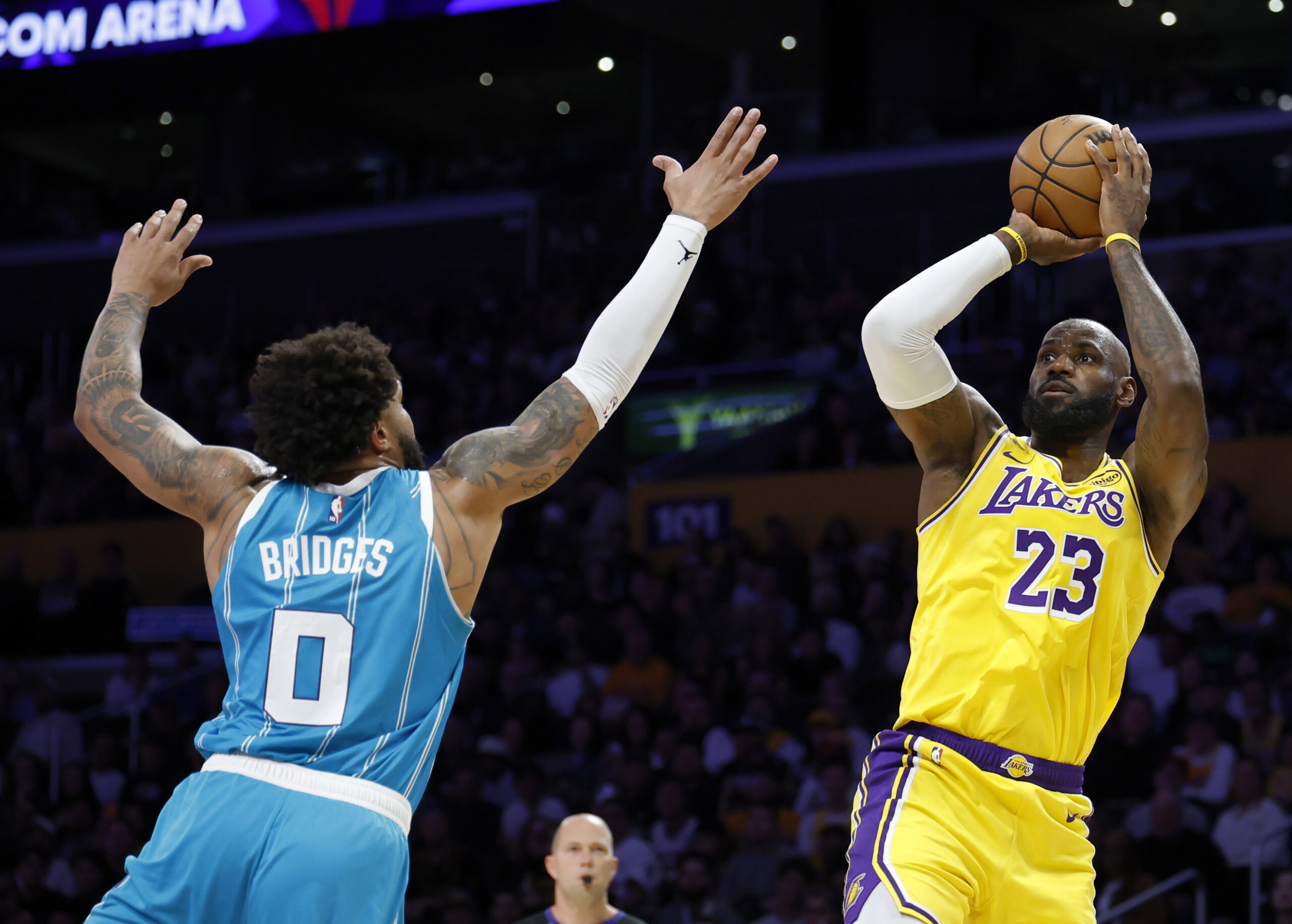 Lakers star LeBron James takes a shot as the Charlotte...