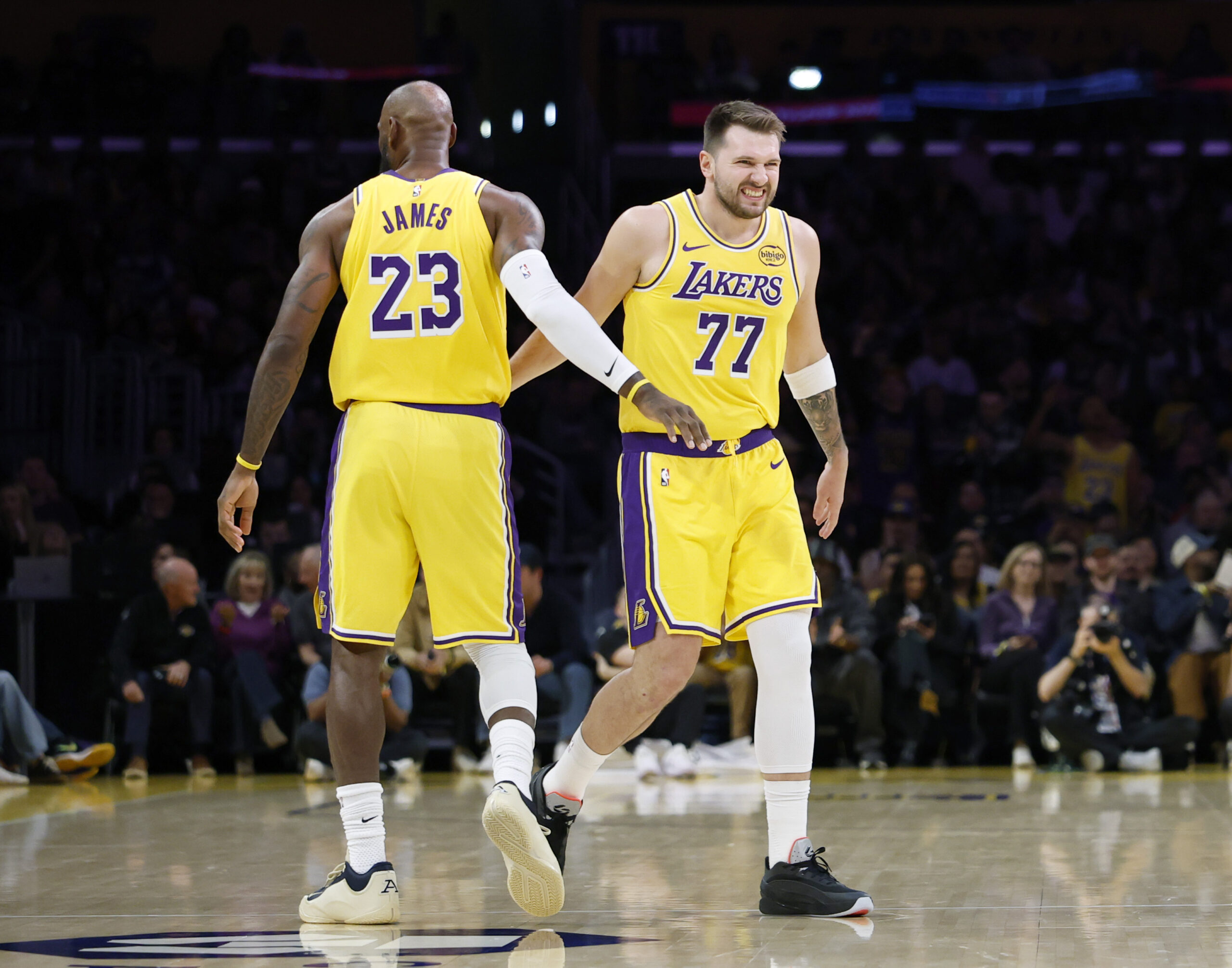 Lakers stars Luka Doncic, right, and LeBron James celebrate a...
