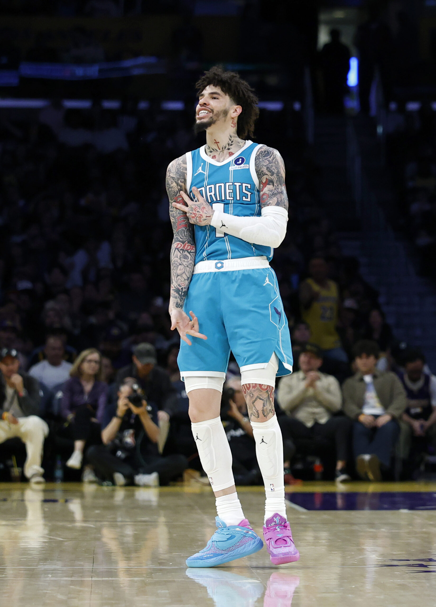 Charlotte Hornets guard LaMelo Ball gestures after making a 3-point...