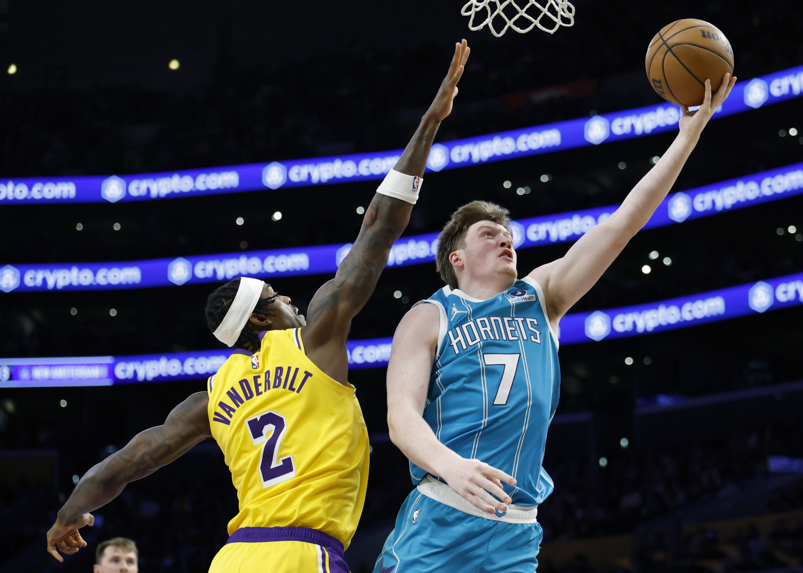 Charlotte Hornets rookie Kon Knueppel scores on a layup past...